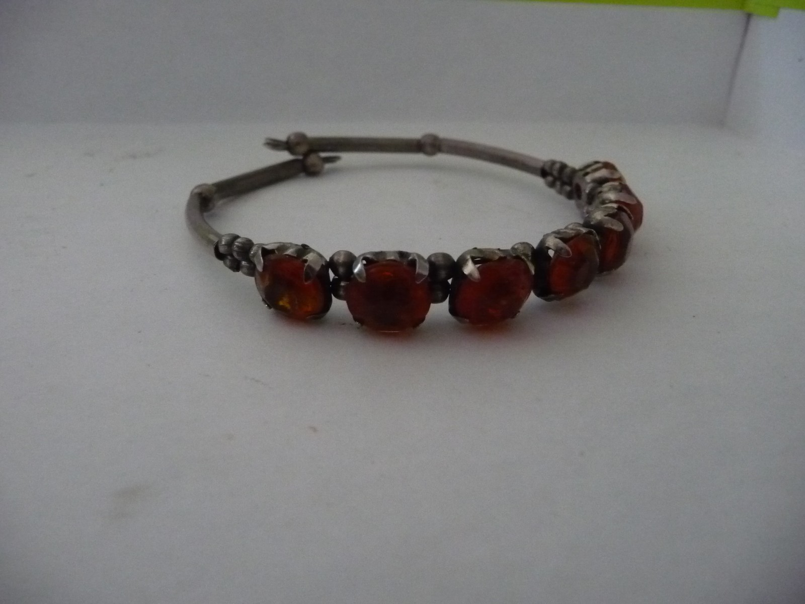 SILVER TONE WRAP AROUND W ORANGE STONE 1/4” W BRACELET #20/12