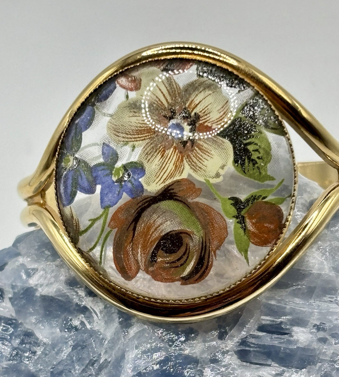Vintage French flower medallion cuff bracelet gold-toned metal and resin.