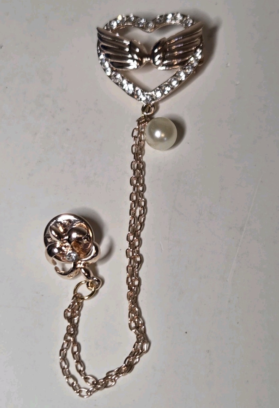 White Austrian Cyrstal Brooch In Rosetone With White Glass Pearl Wings Heart