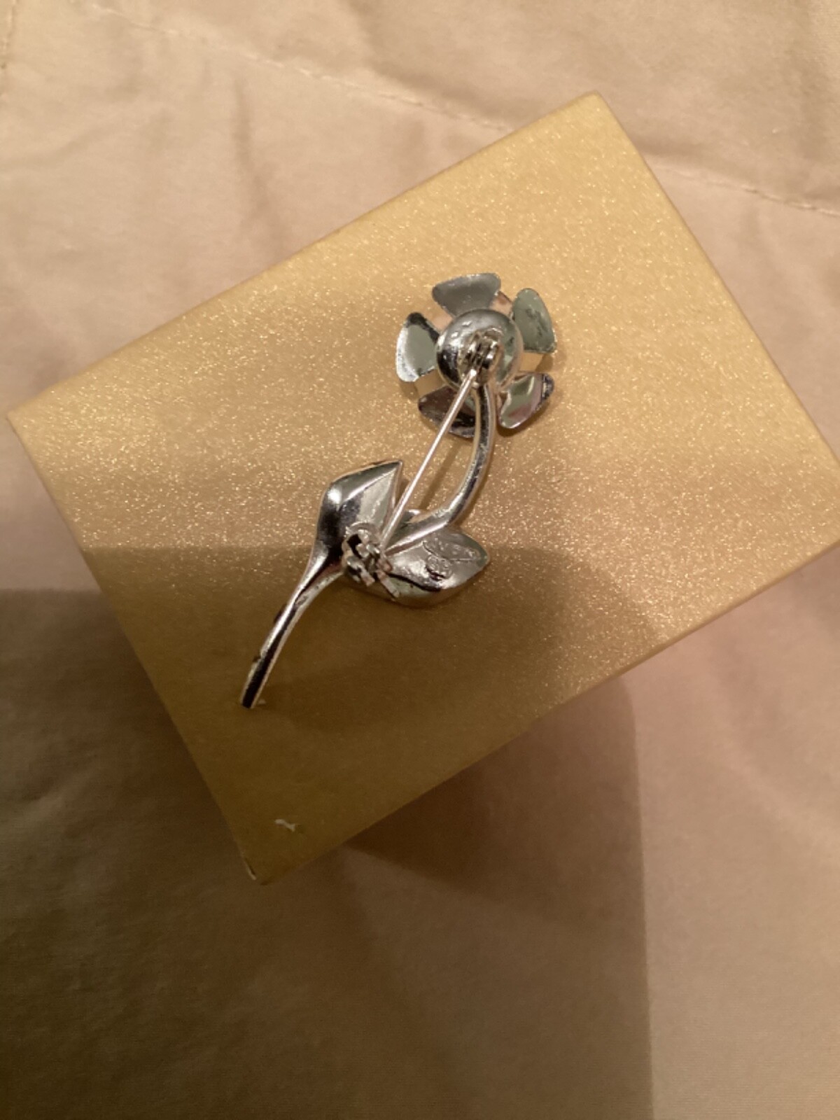 Avon vintage pin clear looking center with green leaves small almost 2” detailed