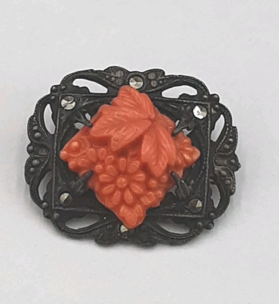 Vintage sterling marcasite coral colored molded peking glass brooch