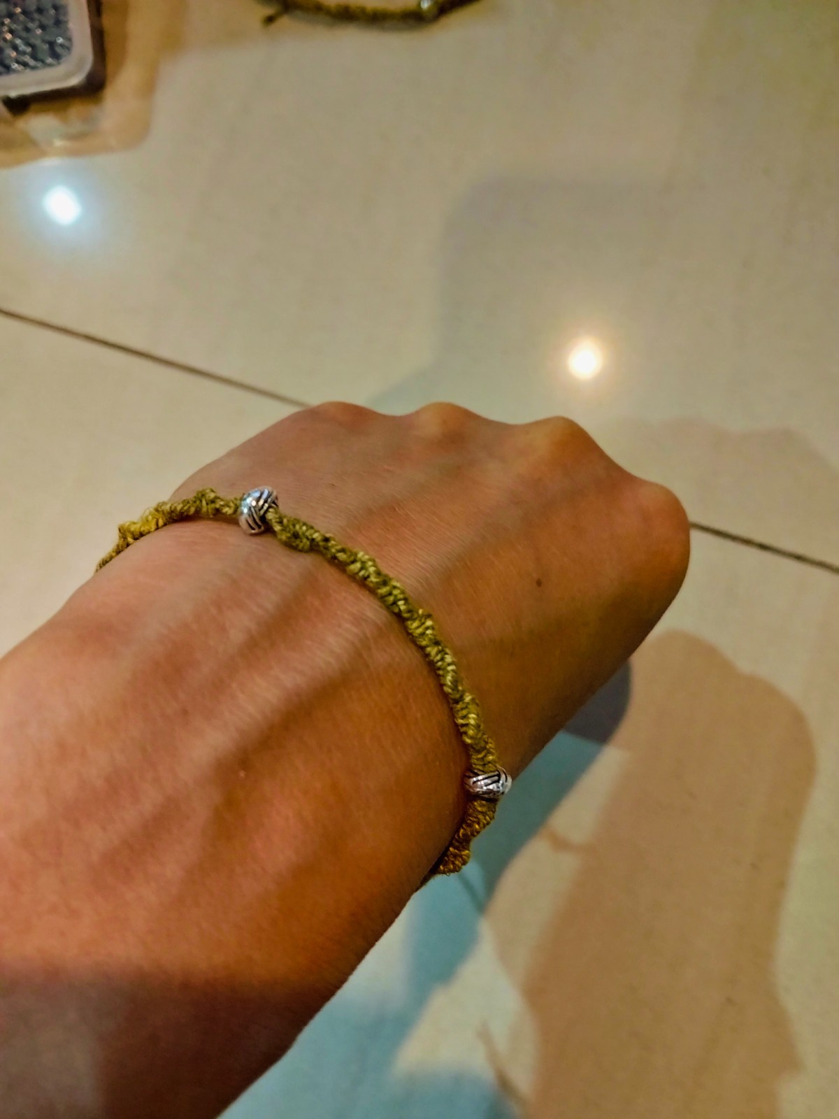 A piece Adj Hemp Bracelet with Natural Marigold & Rust Dye – Boho Style 2 beads
