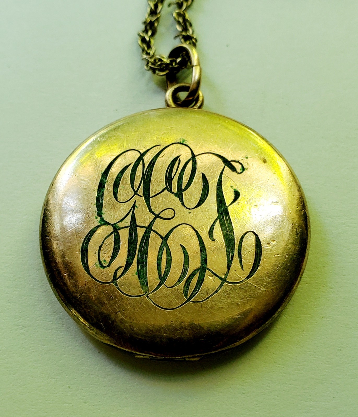 Antique gold tone etched/monogrammed locket pendant necklace stamped F.L.S.
