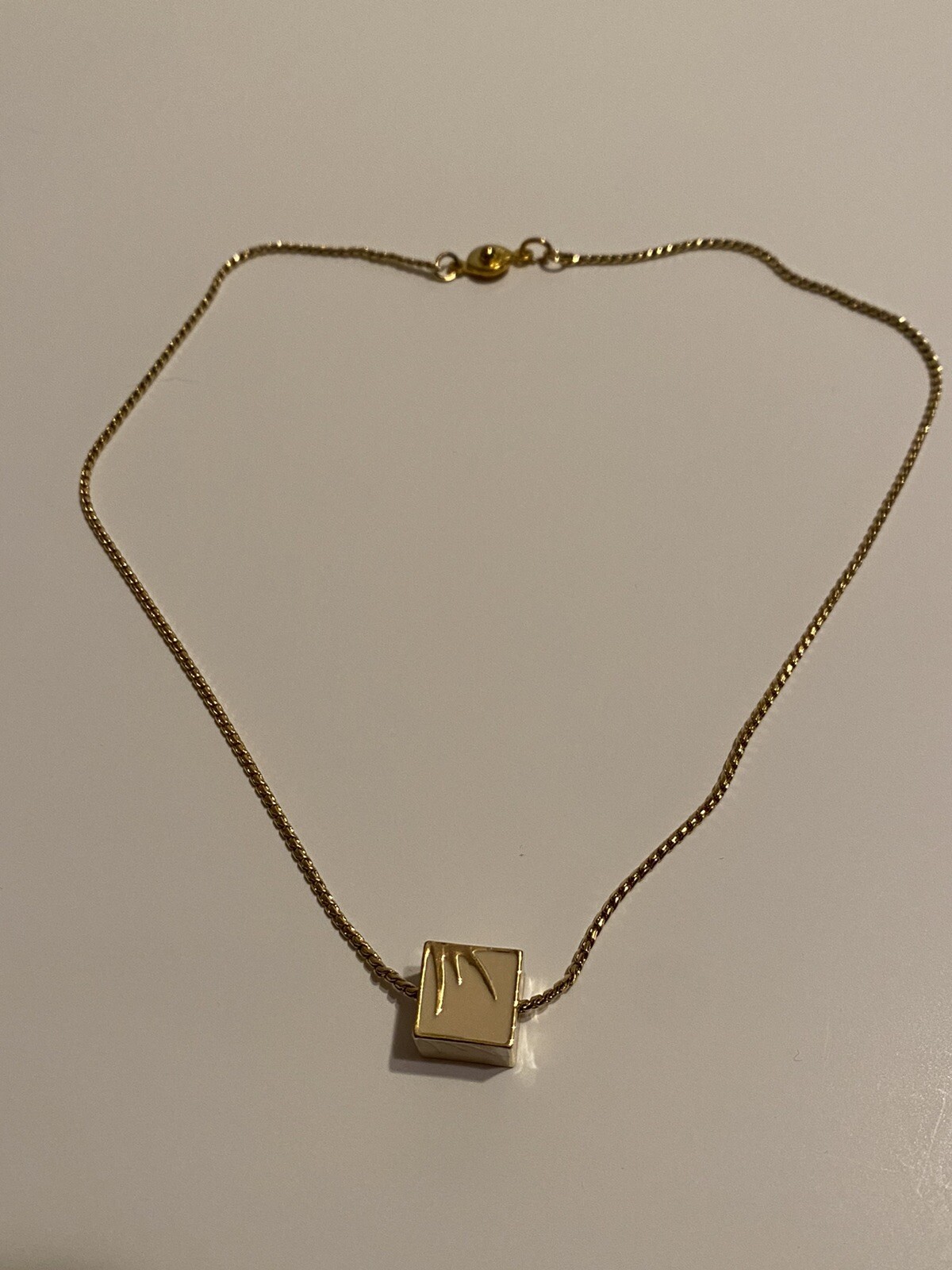vintage Teng Yue minimalist ivory and gold colored cube on 16” gold-tone chain