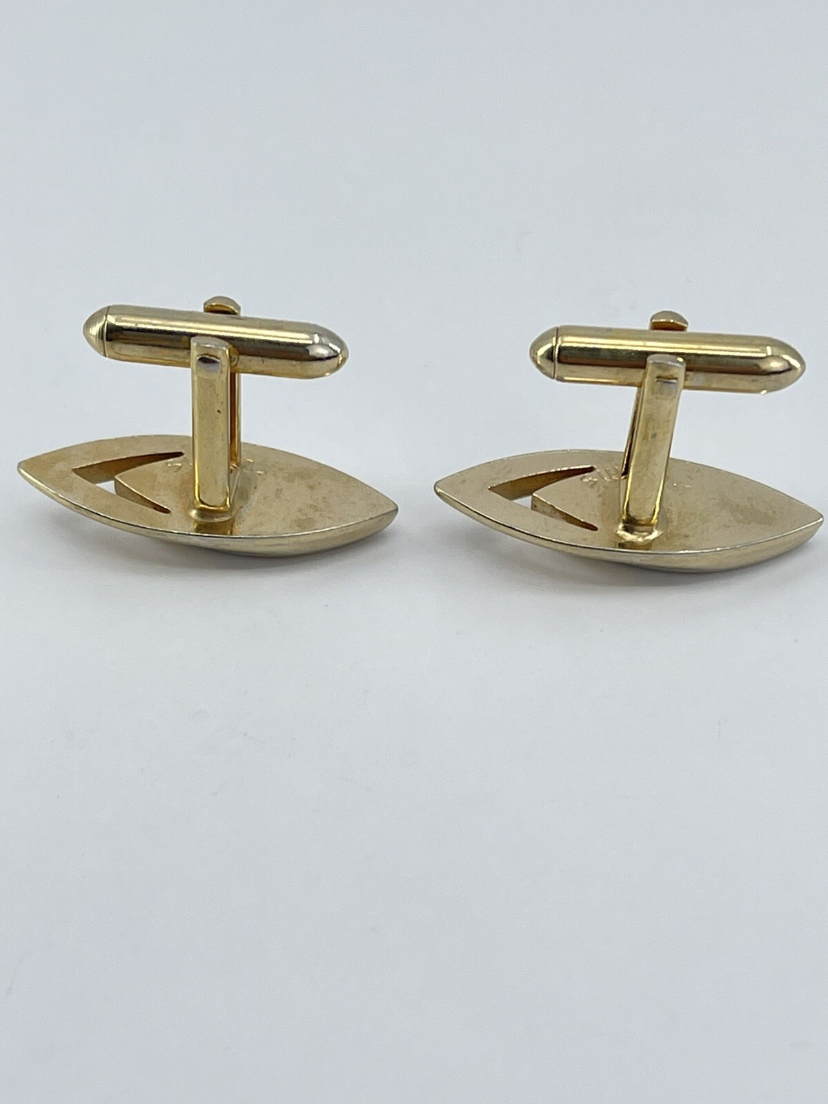 Vintage Swank mens cufflinks torpedo shaped raised cutout design gold tone 3/4″