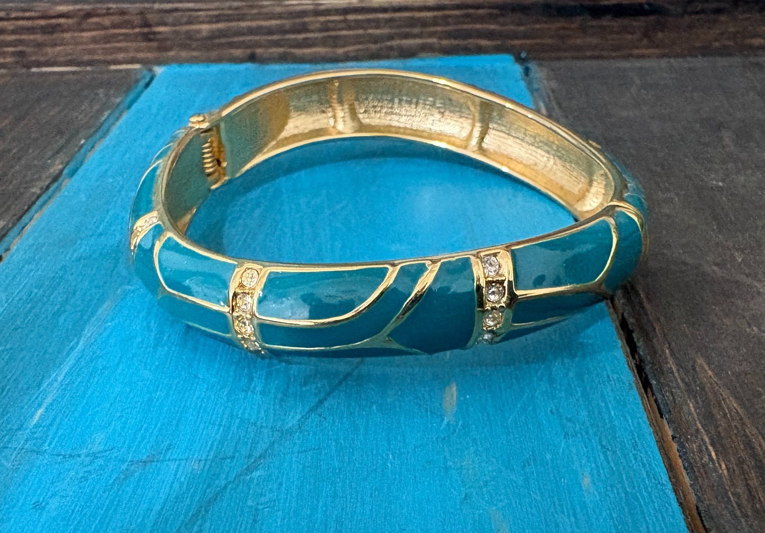 Vintage “Perfect Wave” azure blue enamel and crystal hinged bangle gold tone
