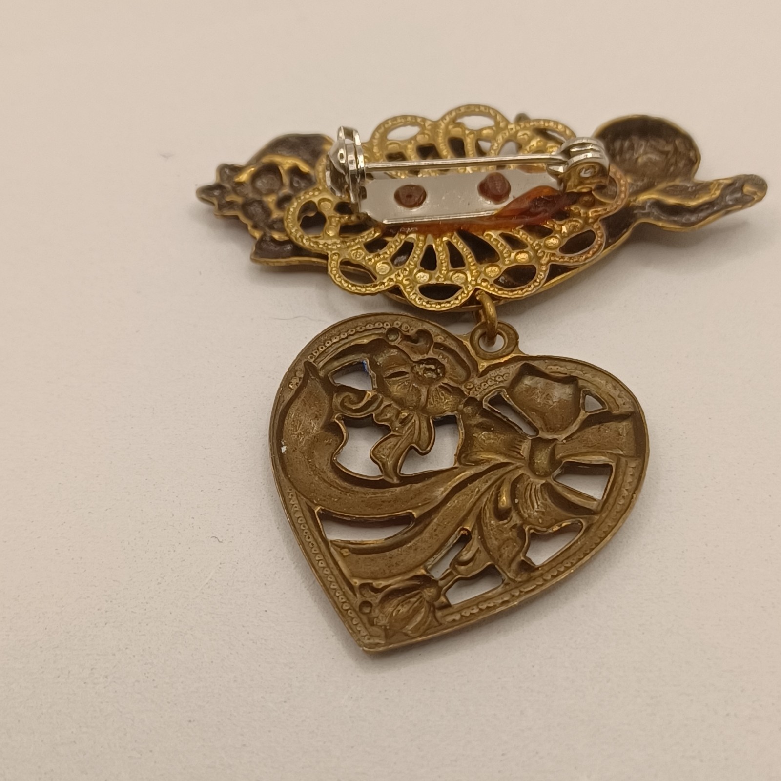 Brass Cherub with Heart Dangle Purple and Blue Enamel flowers and bow Pin Brooch