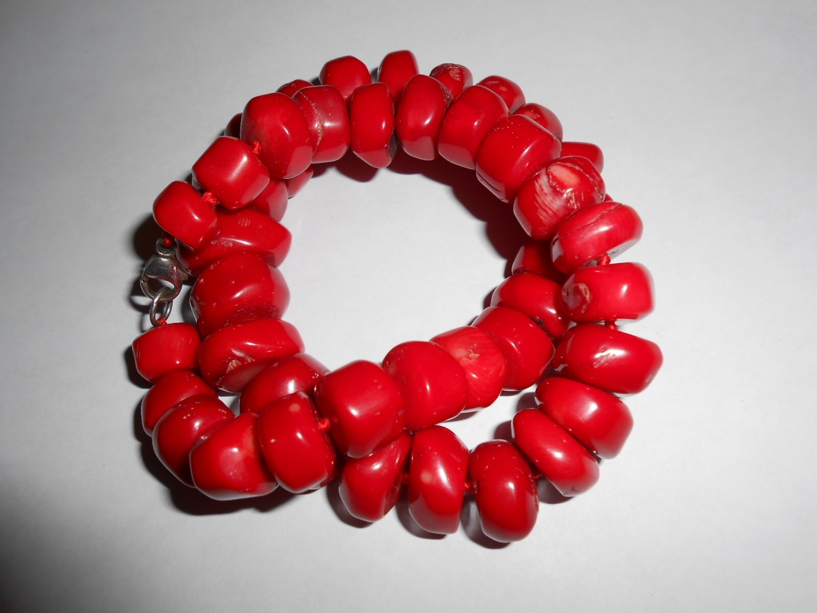 GENUINE UNDYED RED CORAL BEADS NECKLACE WITH STERLING CLASP.