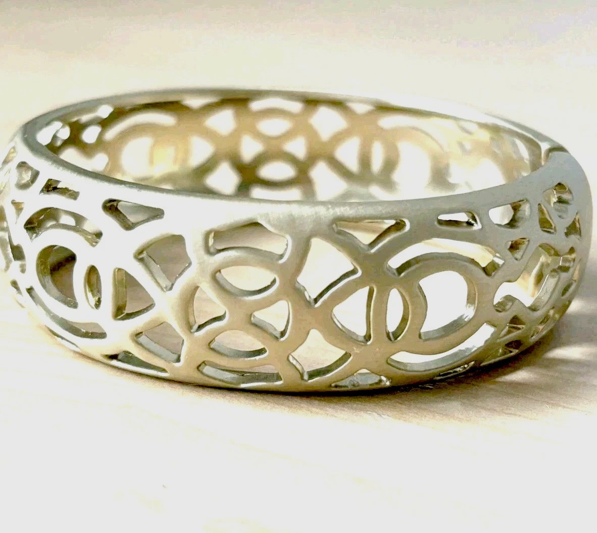 Open filigree hinge bracelet/ brushed antique gold tone/ size 6.75