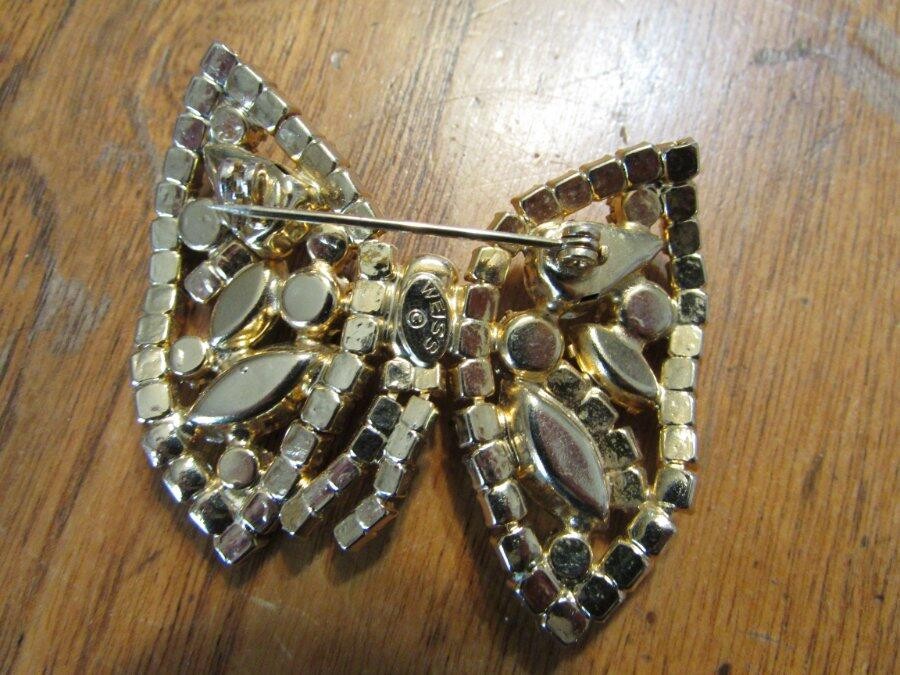 Vintage pale yellow rhinestone asymetrical butterfly ooch marked Weiss