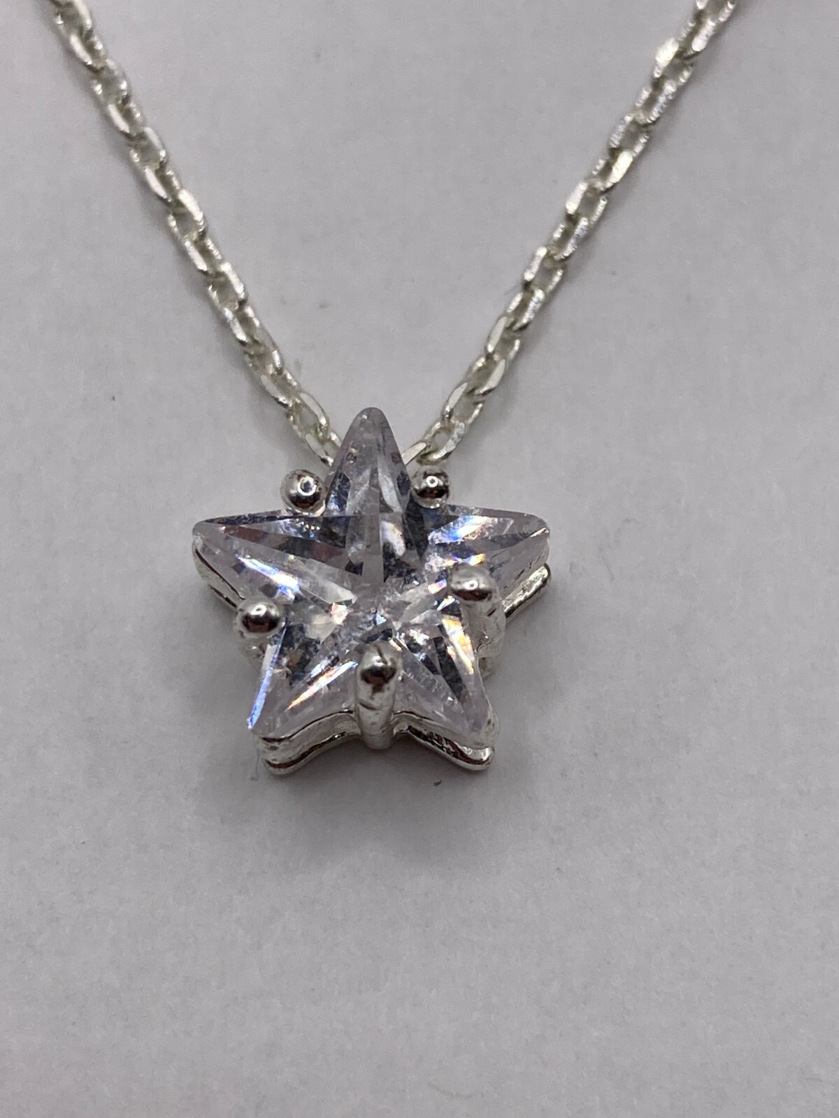 Shimmering Star-Shaped Clear Stone on Delicate Silvertone Necklace