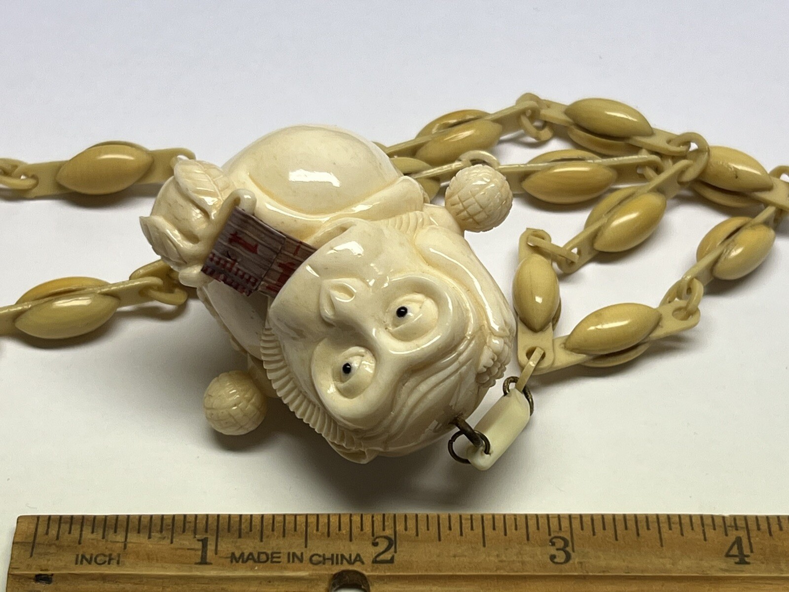 ANTIQUE ART DECO MONKEY NECKLACE TAPE MEASURE CELLULOID CHAIN PENDANT WHIMSICAL