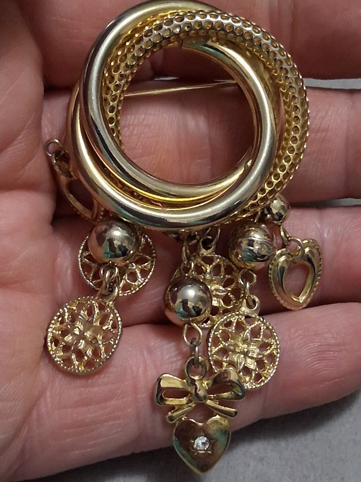Interlocking circle charm brooch, gold-toned dangle drop charms