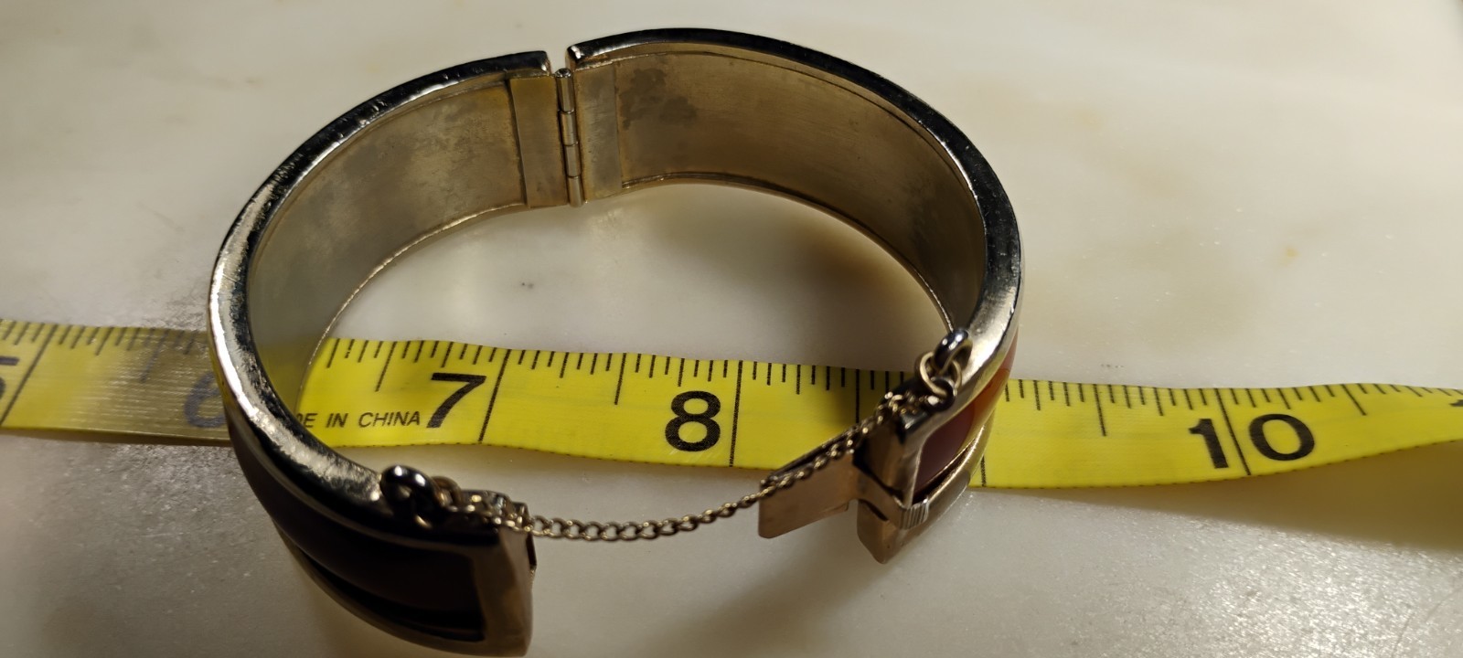 bergere goldtone hinge cuff bracelet inlaid w/soft redish brown material-nd6