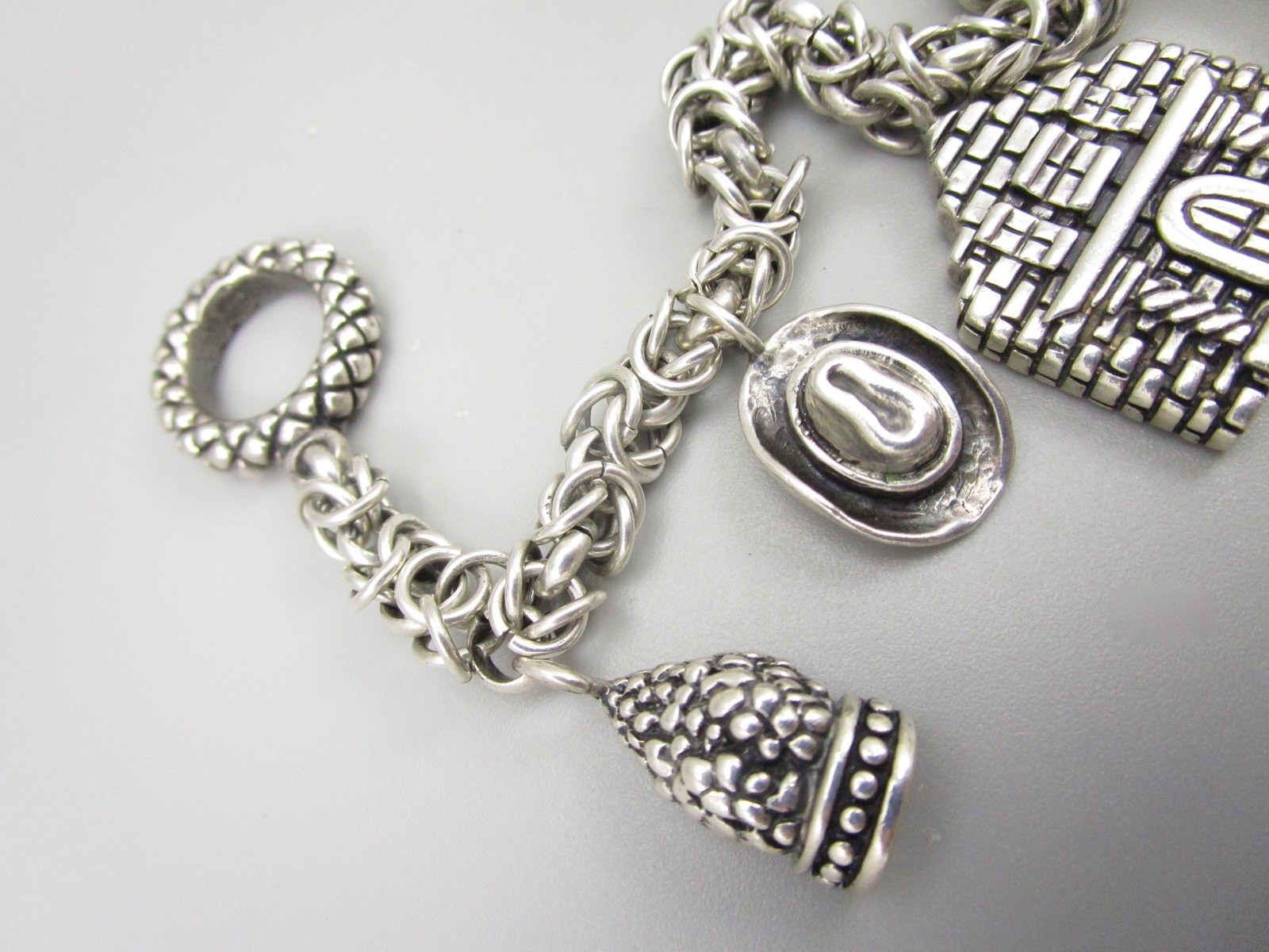 SCARCE DIAN MALOUF STERLING SILVER TEXAS THEME CHARM BRACELET 60 GRAMS