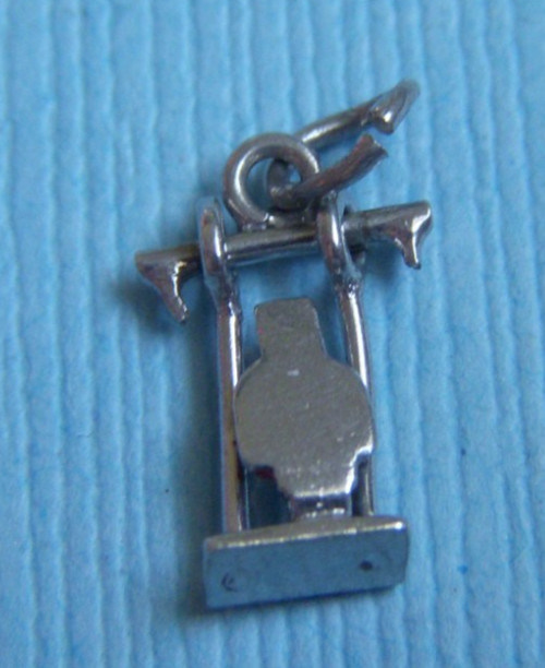 Vintage movable enamel person on swing sterling charm