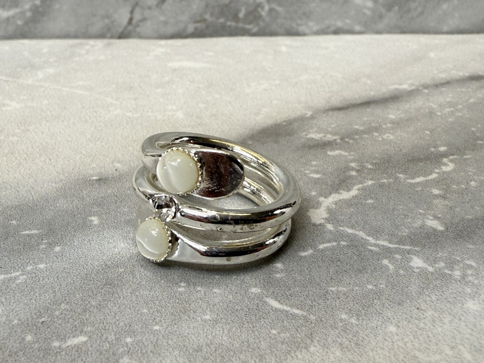 Silver tone wrap with white cat eye and righnstone ring size 6