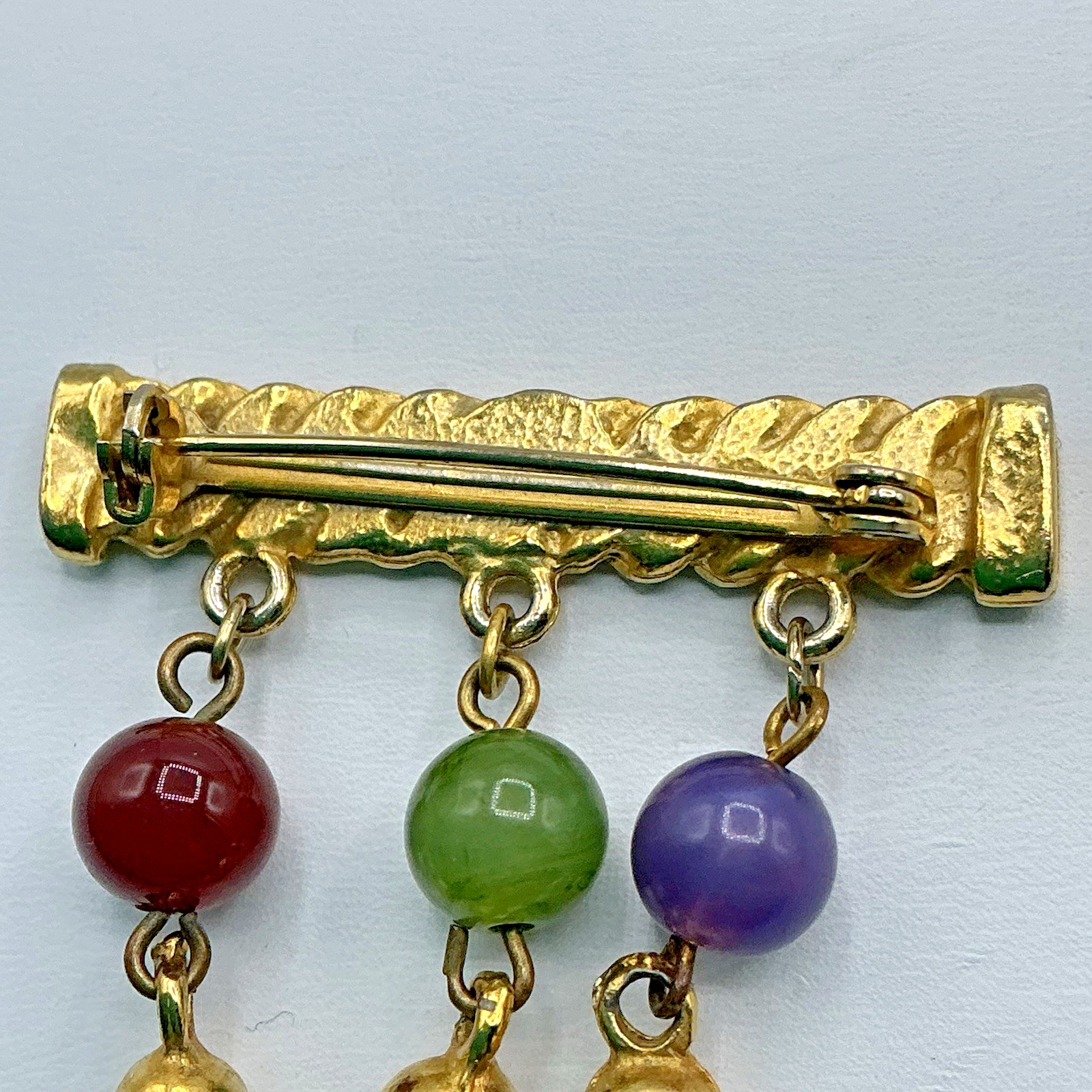 Vtg Gold Tone Bar Pin w/ Dangling Semi Precious Stones Purple Green Red Brooch