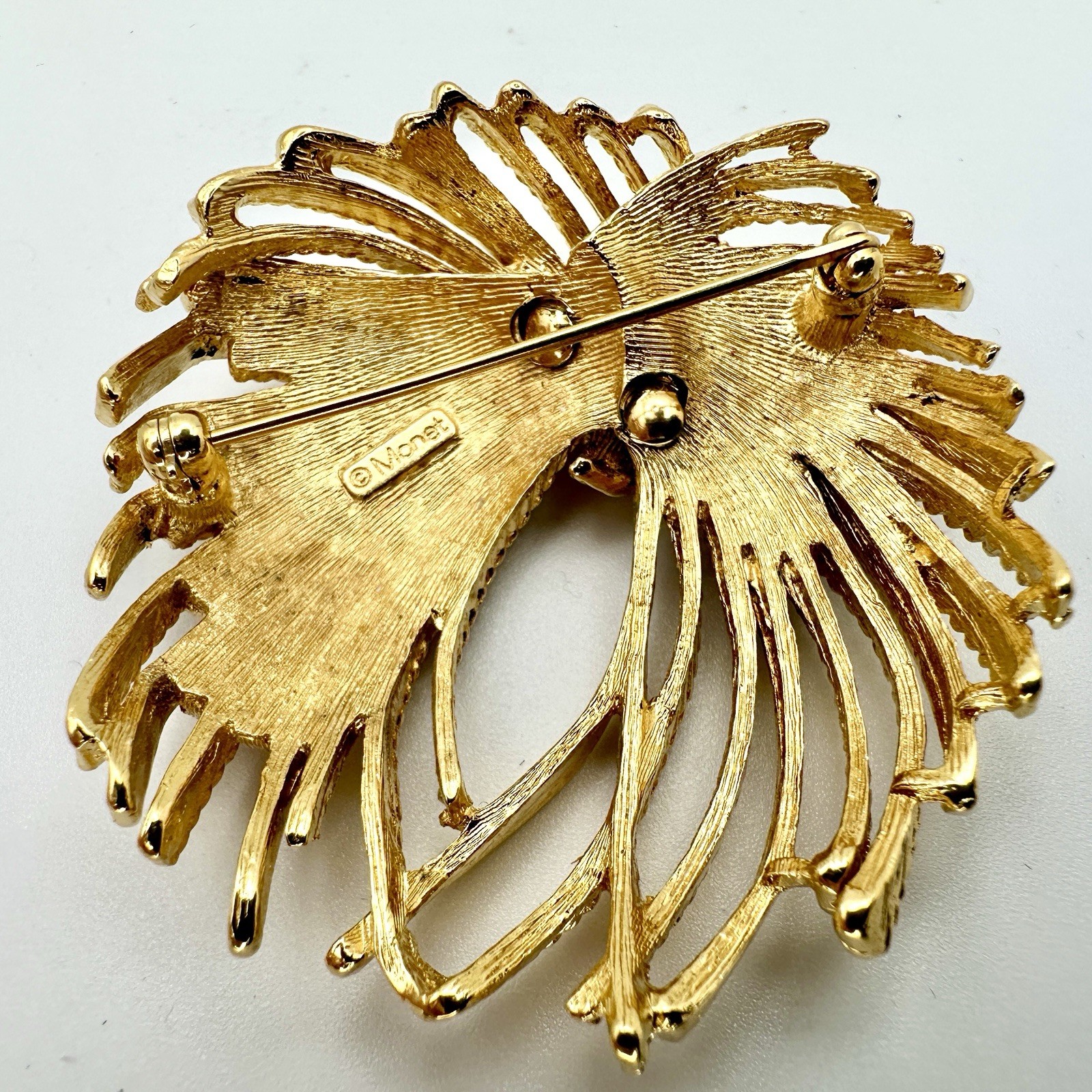 VTG MONET Cordelia Mirador Brooch Gold Tone Fire Works Knotted Rope Pin 2”