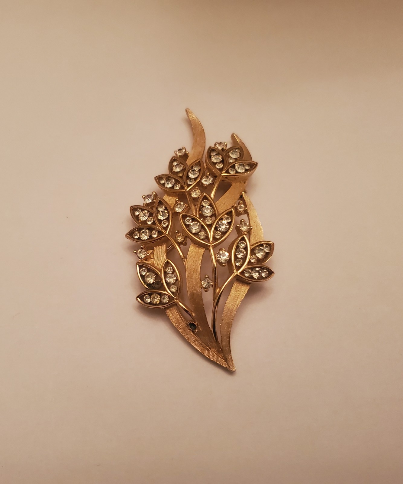 Vintage Trifari Brooch Features Floral Bouquet Design Crafted From Gold-Toned…