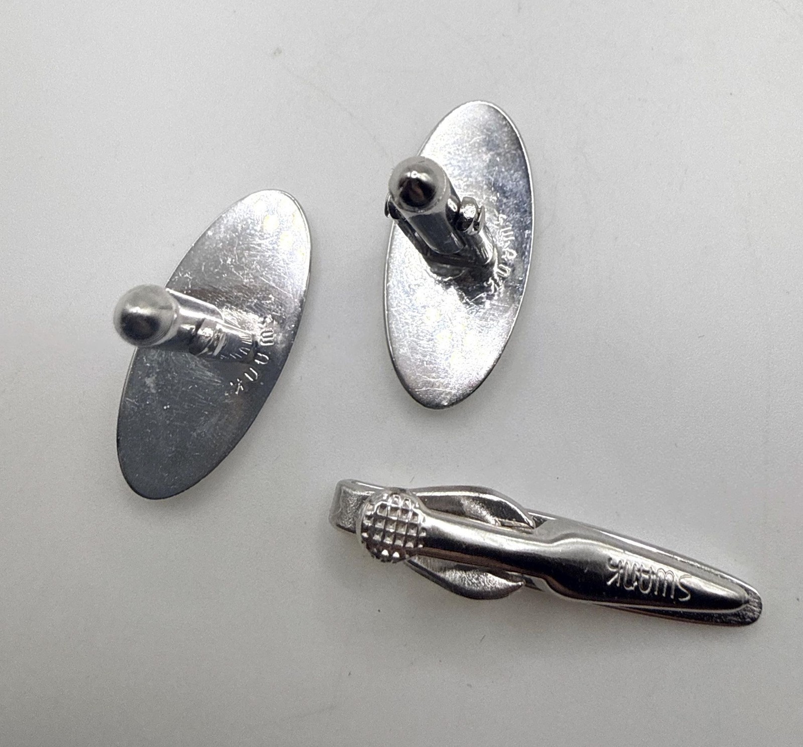 Vintage Swank silver tone textured elongated oval cuff links and tie clip set