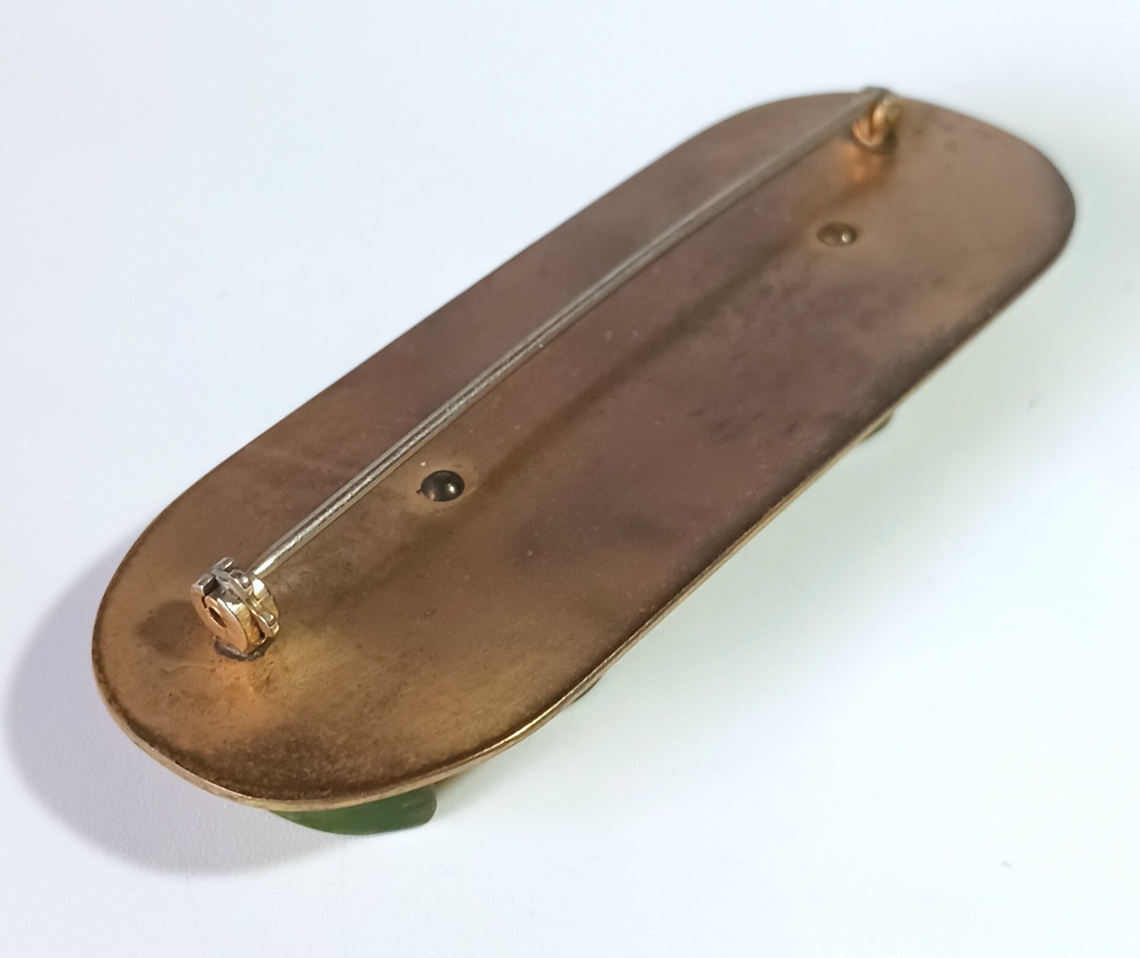 Vintage Art Deco Brooch: Carved Dark Green Bakelite on Polished Oval Brass Base