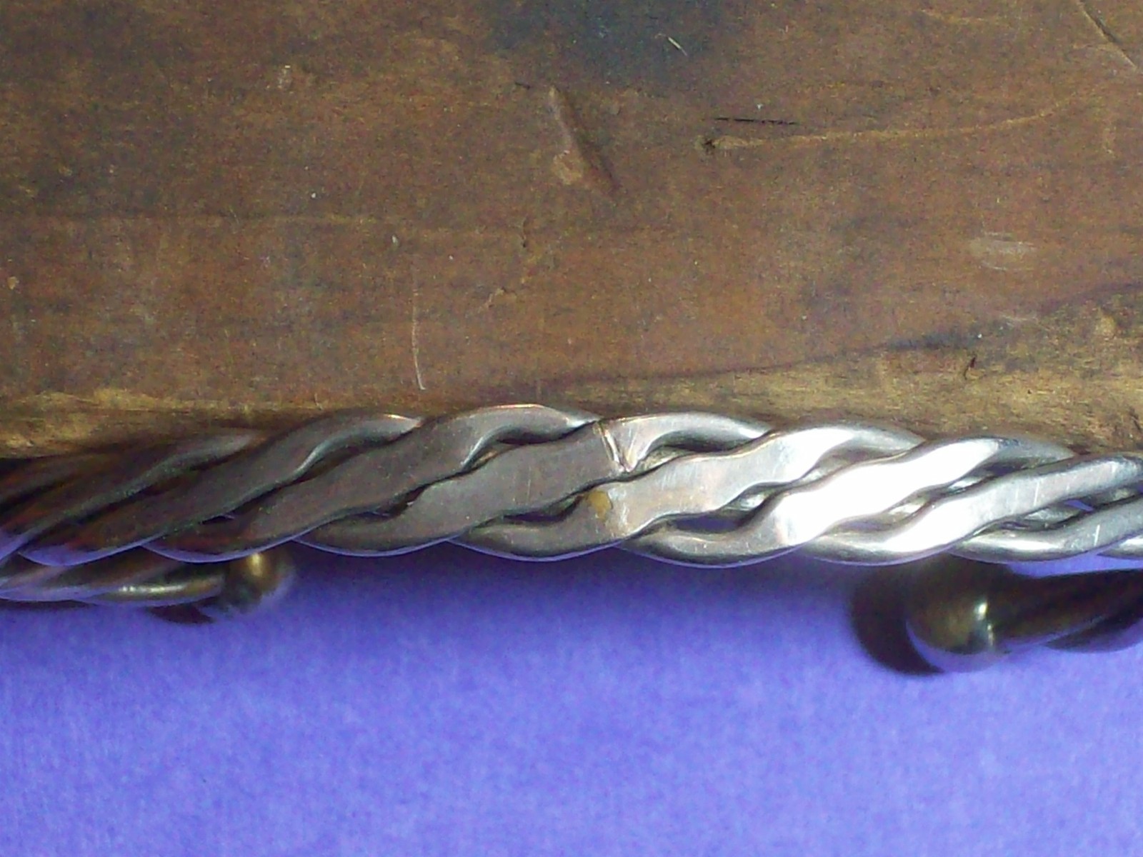 BRACELET ROPE STYLE SILVERY APPEARANCE 2 ¼” ACROSS INSIDE x 1 5/8” WIDE.