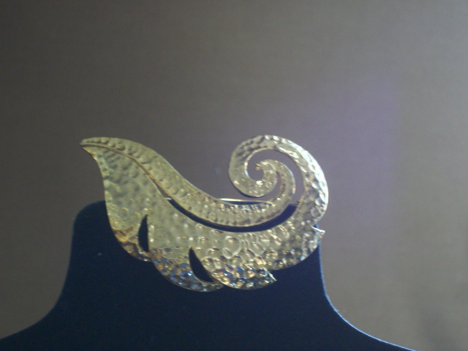 Hammered gold plated curled leaf