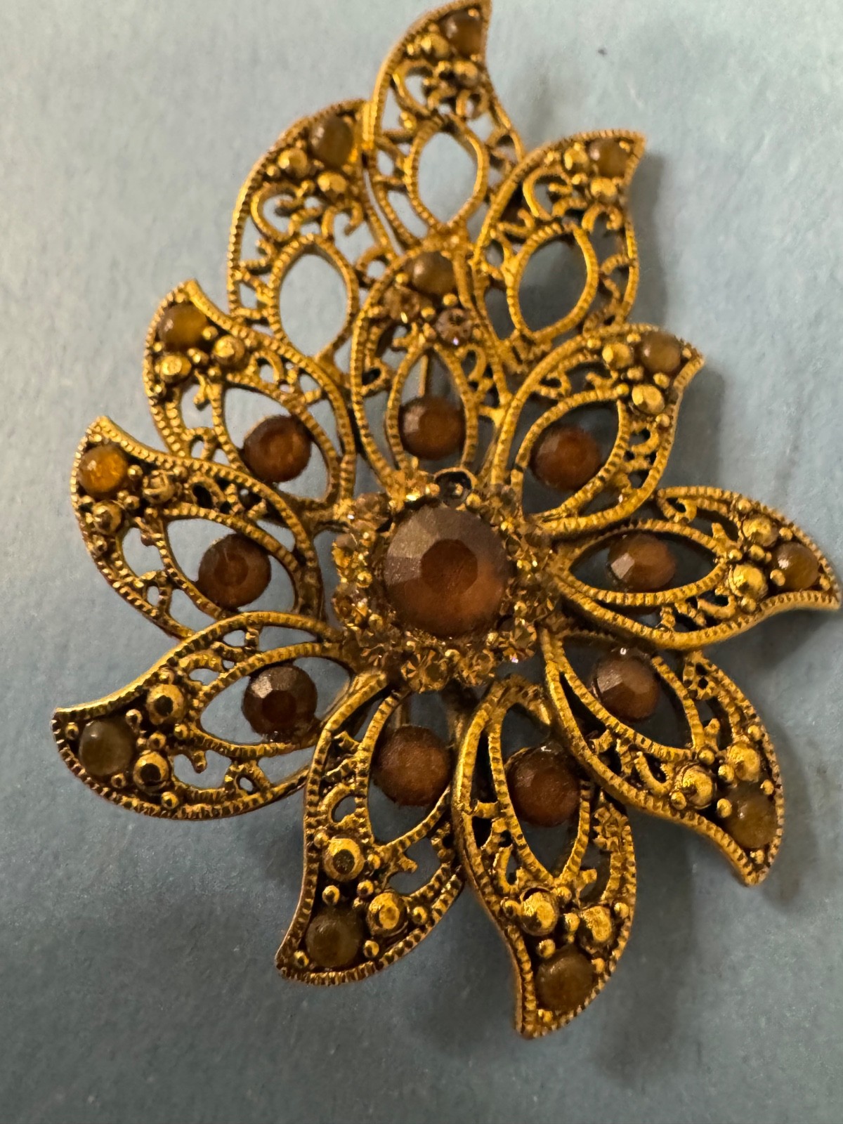 Gold Tone Brooch with Amber and Brown Glass Stones In A Floral or Leaf Design