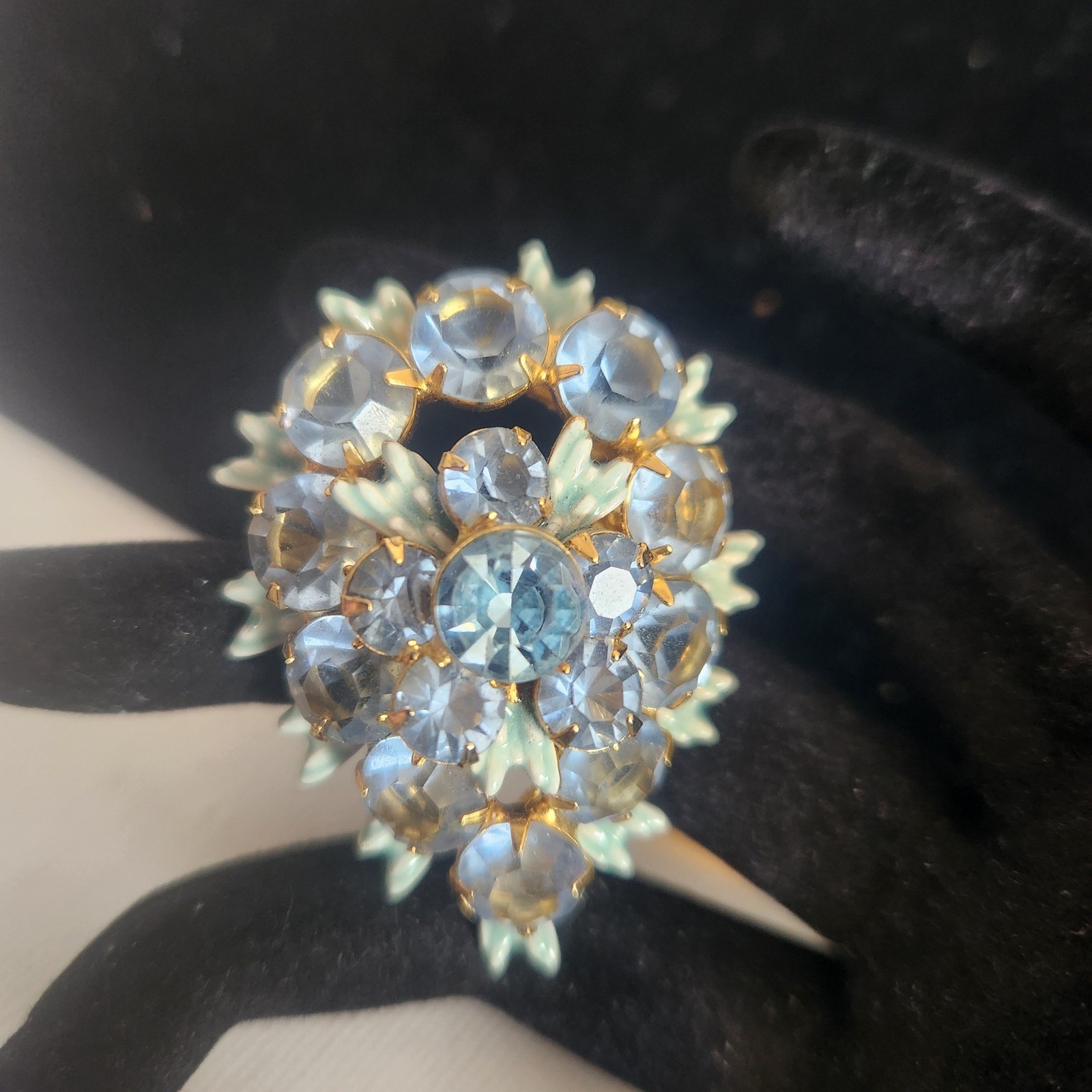 Vintage Light Blue Rhinestone Floral Cluster brooch Gold Tone Enamel Leaf Detail
