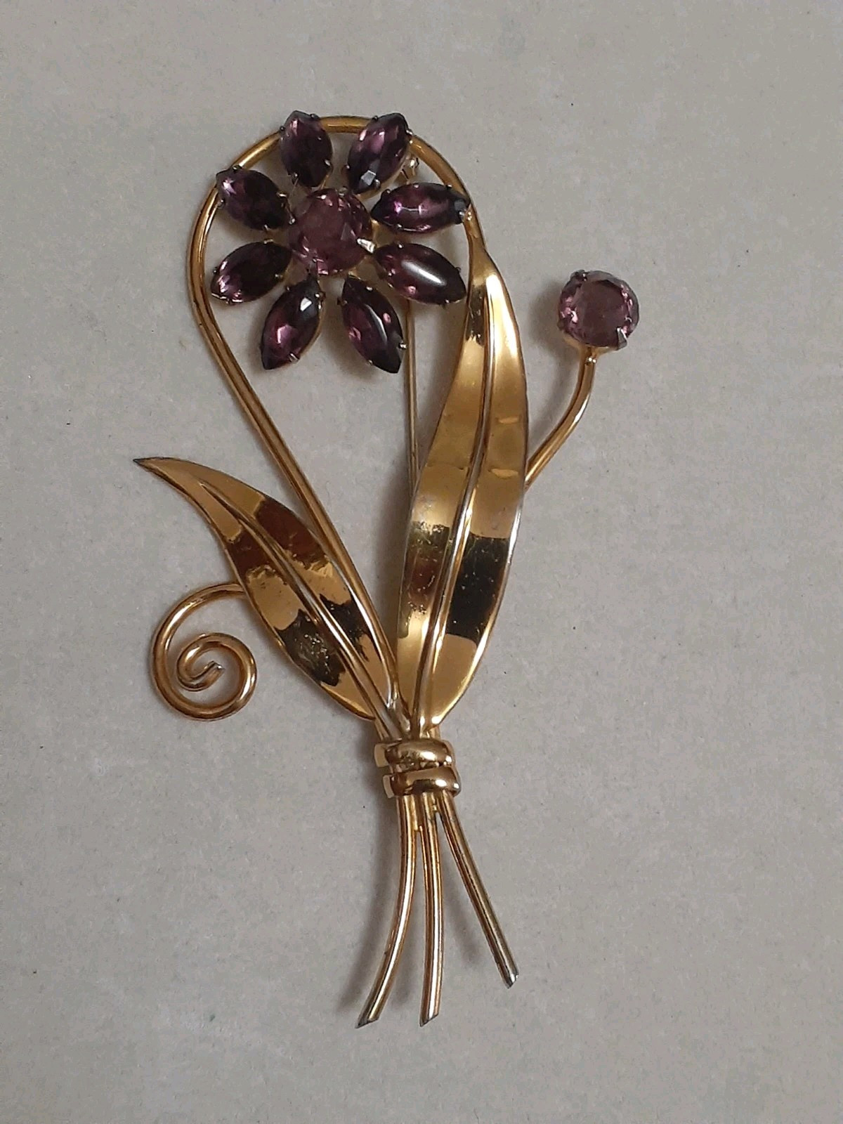 Sterling silver gold plated prong set purple glass flower & stem leaf brooch