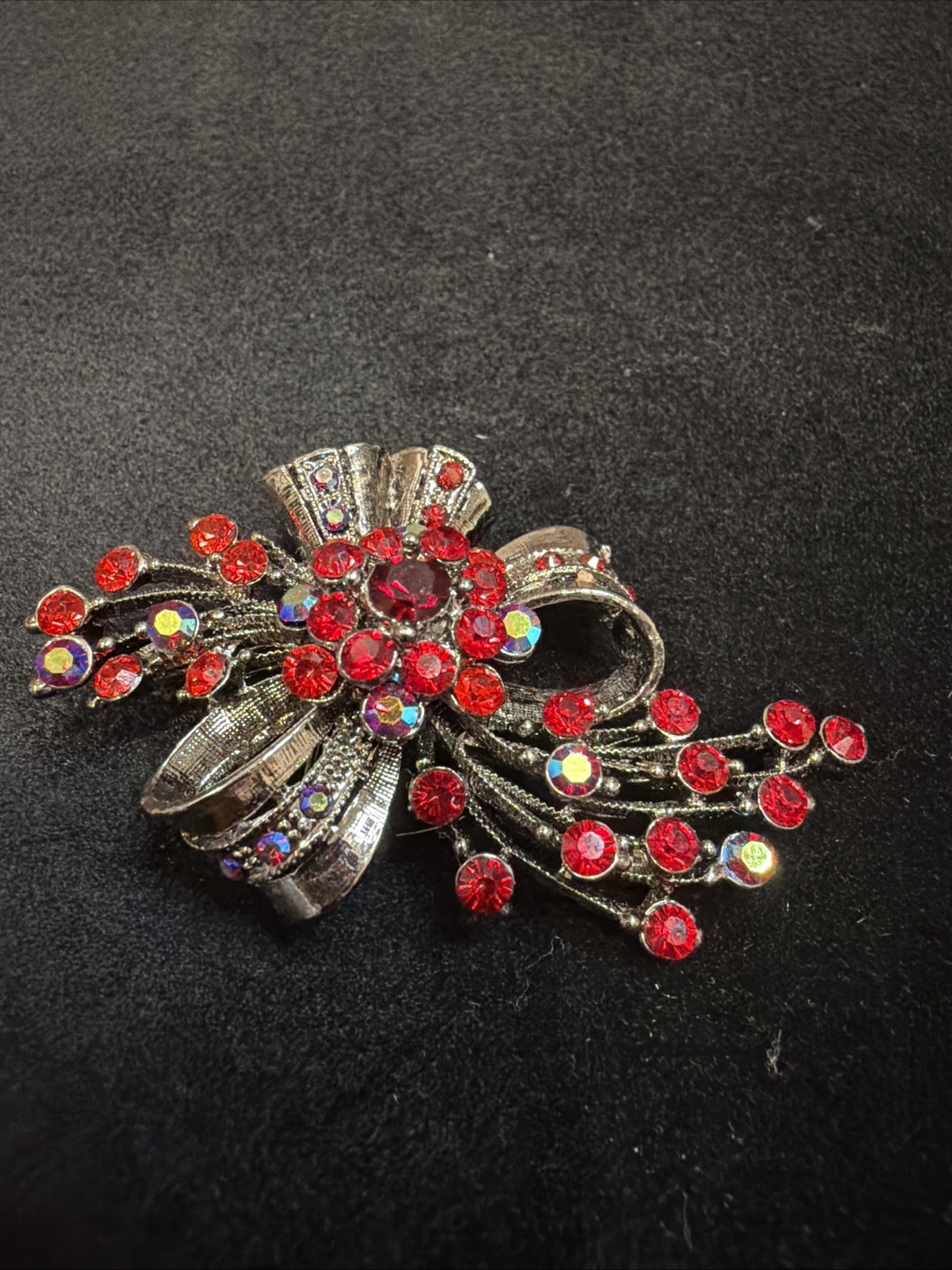 Vintage Bow Brooch Gunmetal-toned With Red Iridescent Rhinestones