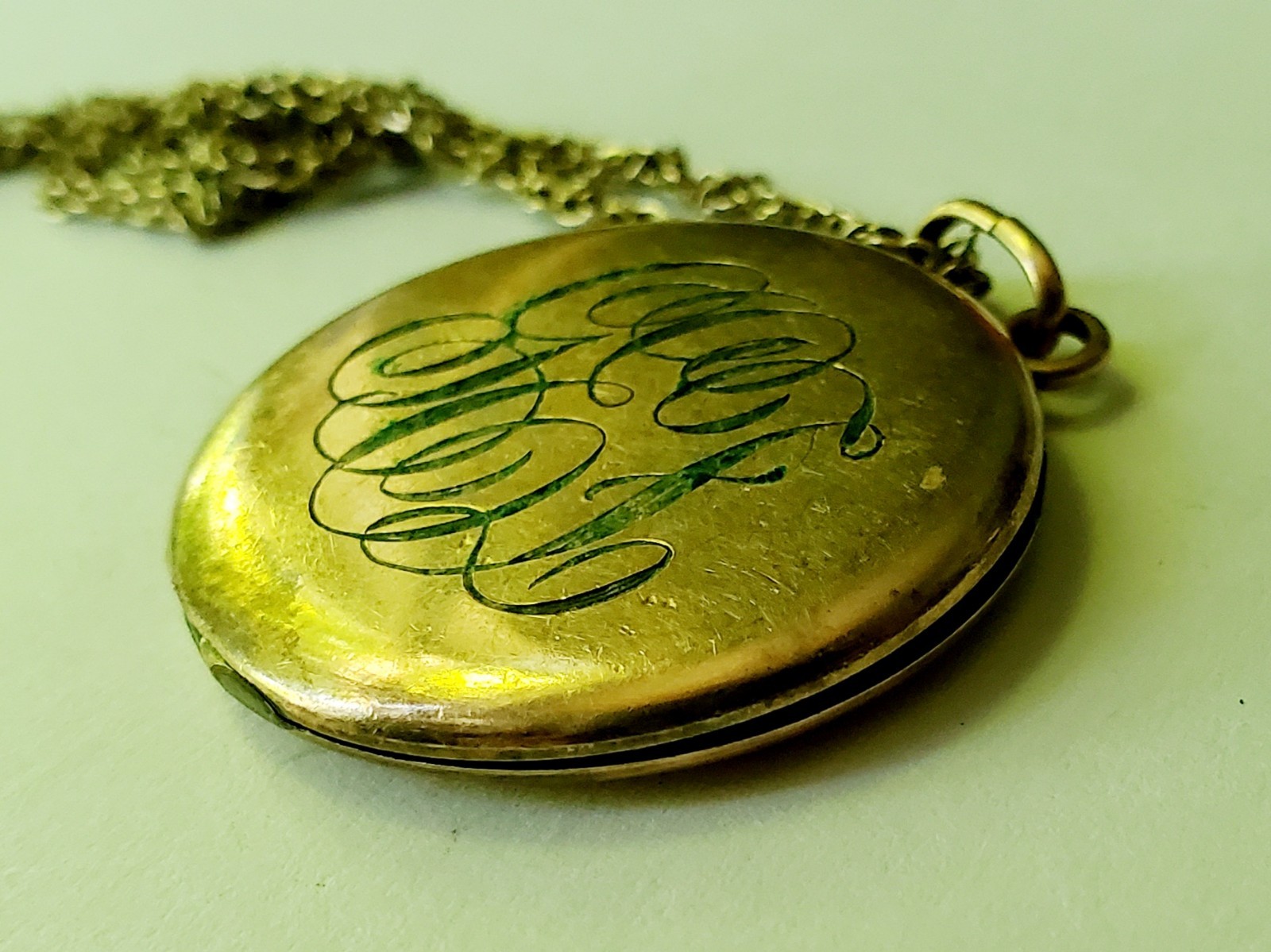 Antique gold tone etched/monogrammed locket pendant necklace stamped F.L.S.