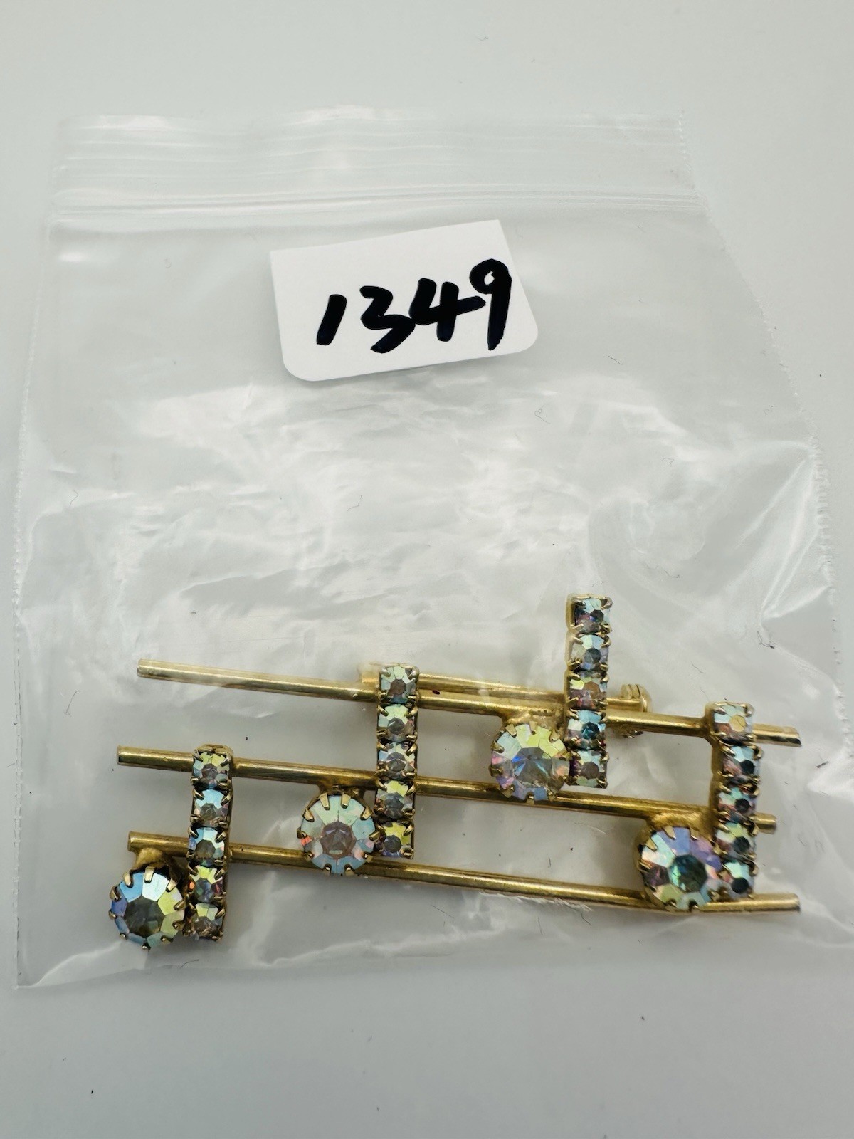 Vintage gold tone rhinestone music notes brooch