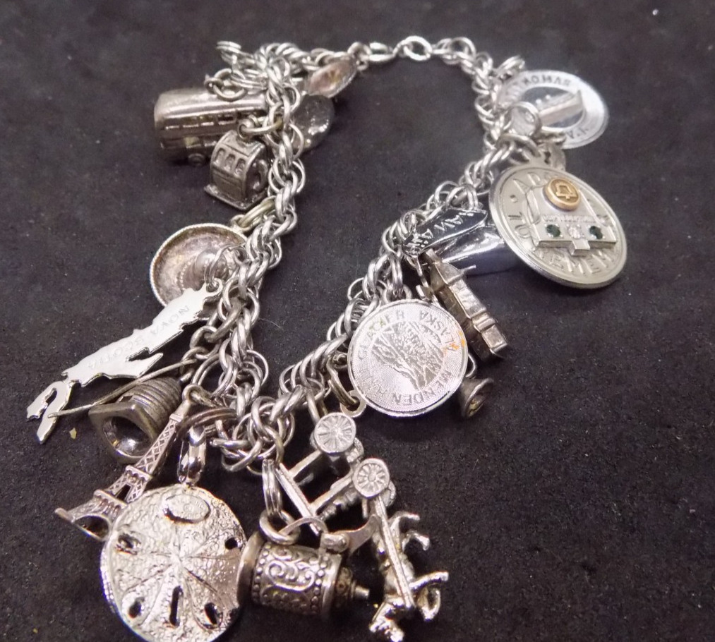 vintage silver charm bracelet loaded with charms alot are marked sterling (541)