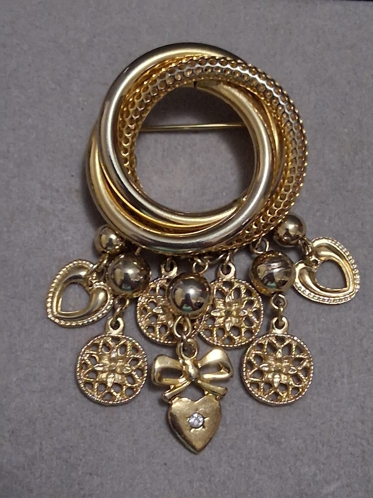 Interlocking circle charm brooch, gold-toned dangle drop charms