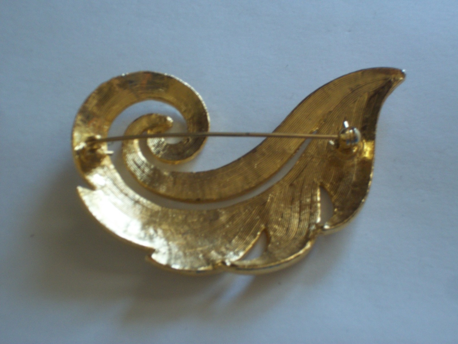 Hammered gold plated curled leaf