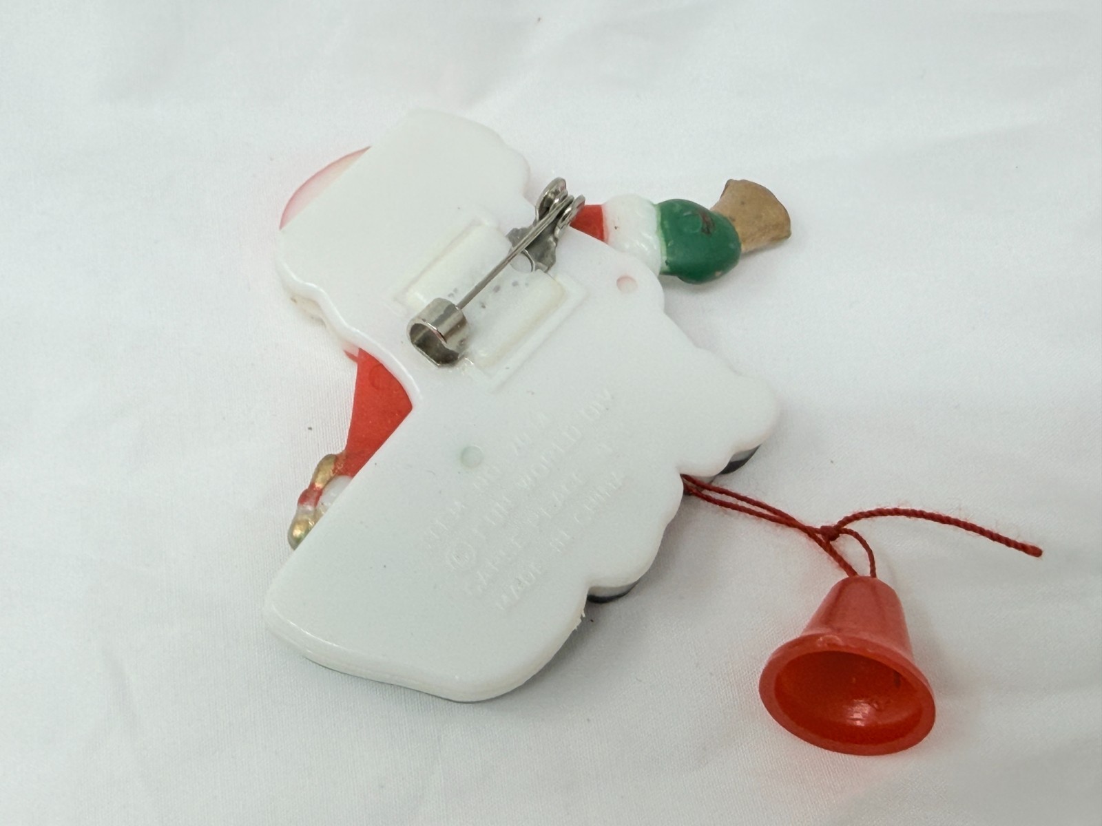 Vintage Fun World Santa Claus Moving Arms Sack of Toys Christmas Plastic Pin