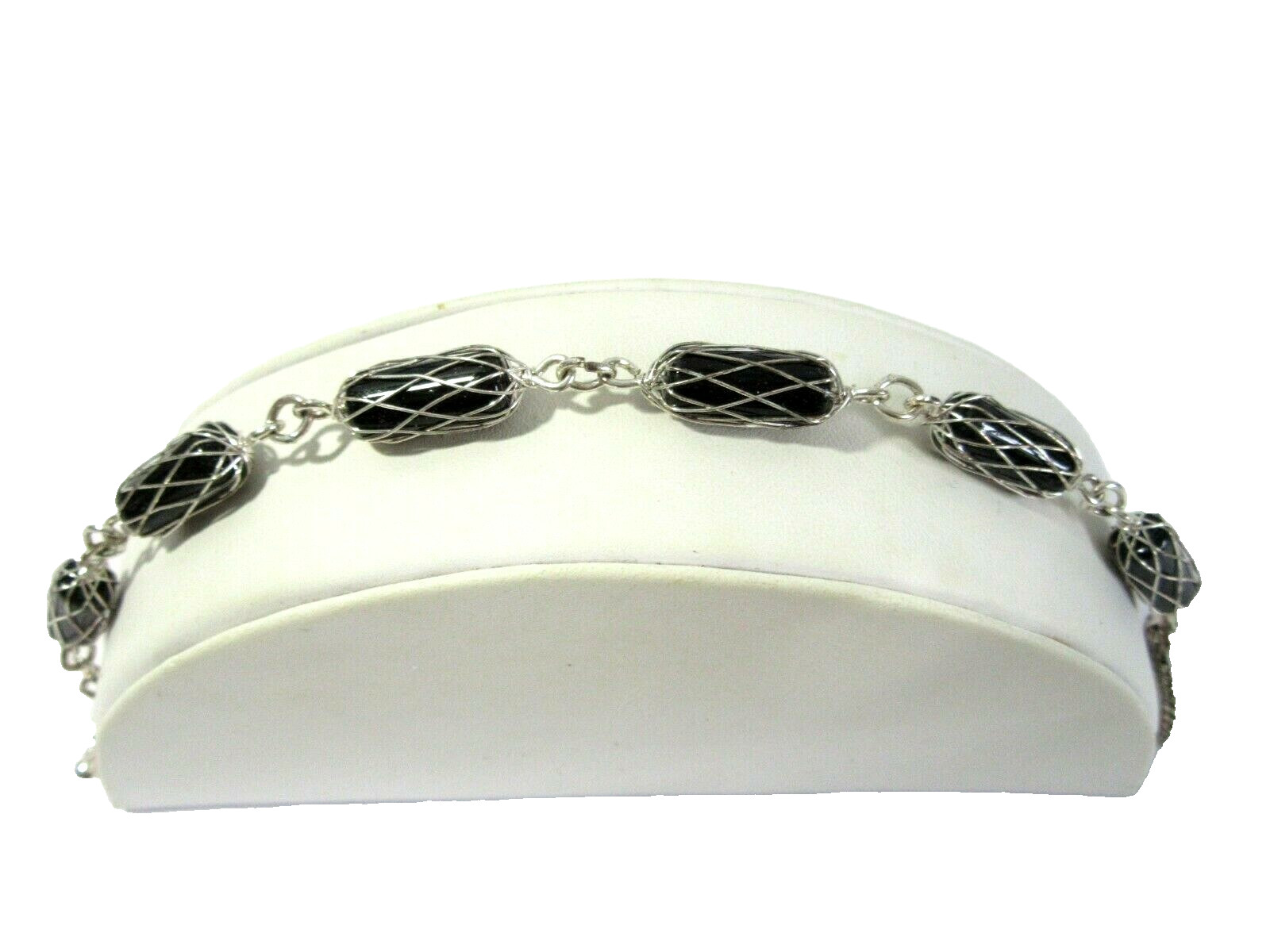 BLACK TUBE BEAD BRACELET WITH SILVER TONE WIRE WRAP CAGED DESIGN TOGGLE CLASP