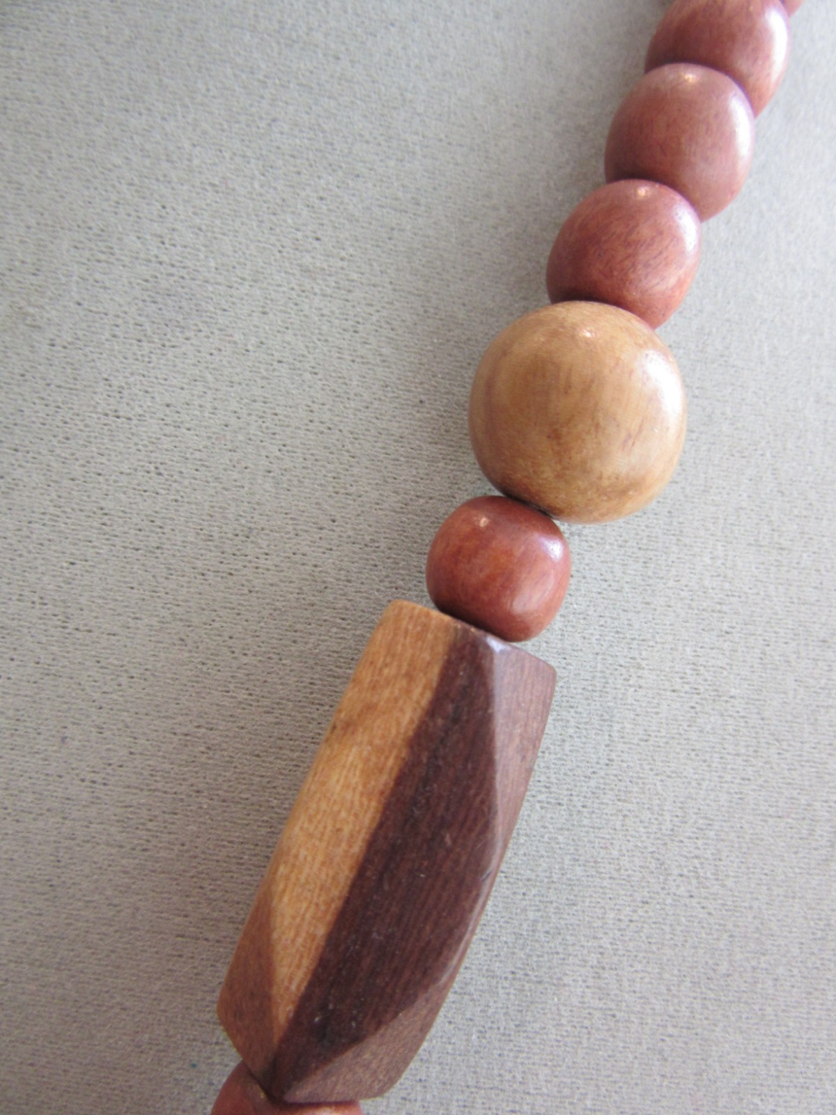 Vintage polished and faceted wood beaded necklace -22″ long
