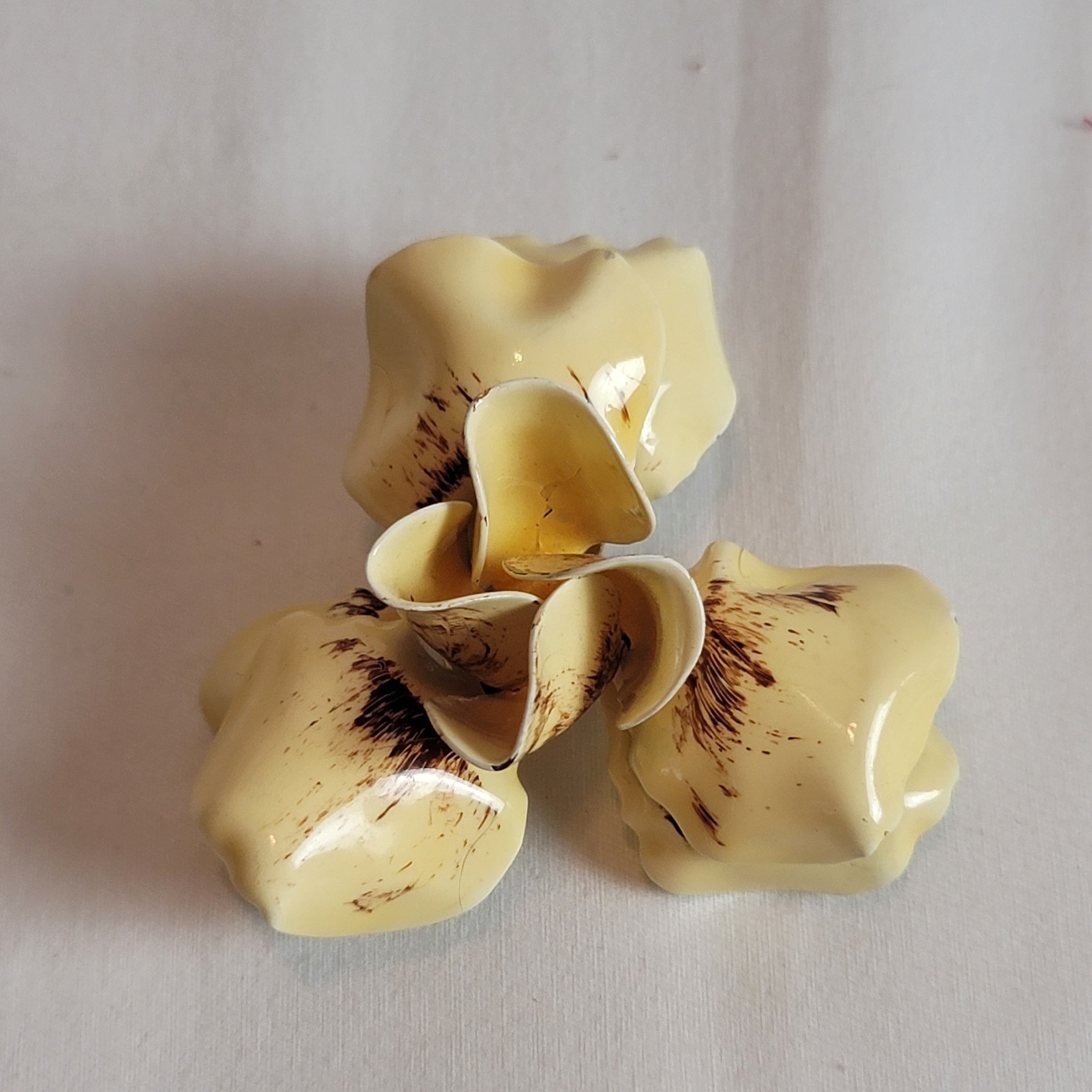 vintage floral clip-on earrings and brooch with a cream and brown enamel finish
