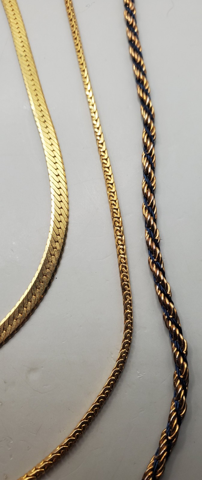 3 Vtg Chains: Trifari 24″, Herringbone 20″, Gold Tone & Black Twisted Rope 30″