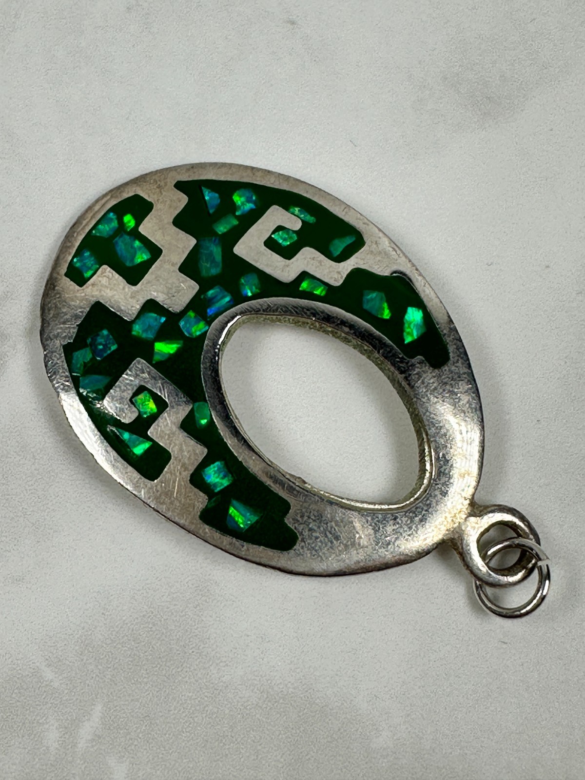 Sterling Silver Green Opal Chip Inlay Oval Cut Out Pendant – 1 1/2″ Long