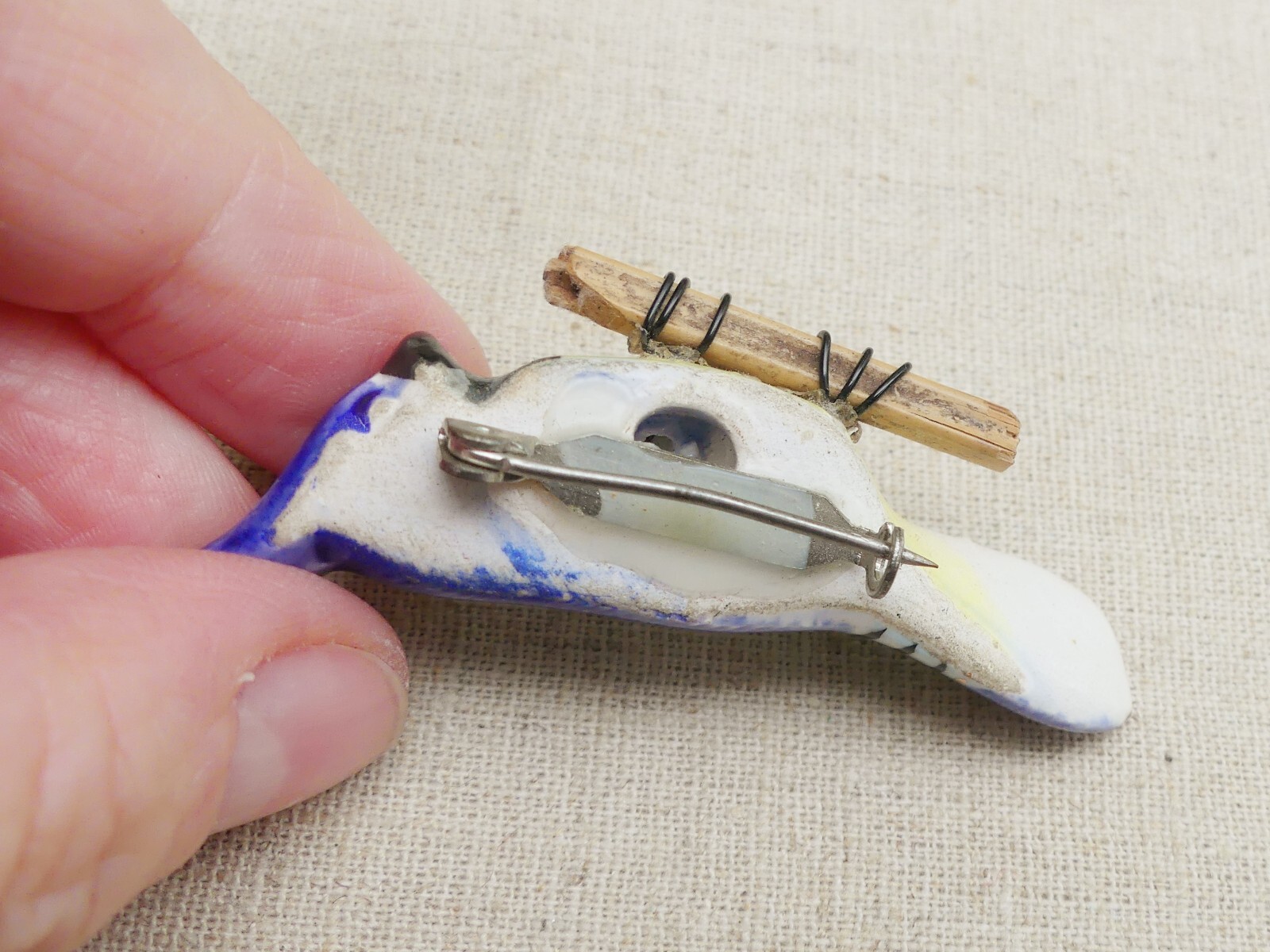 Vintage ceramic blue jay brooch on wood branch bird hand-painted gilt porcelain