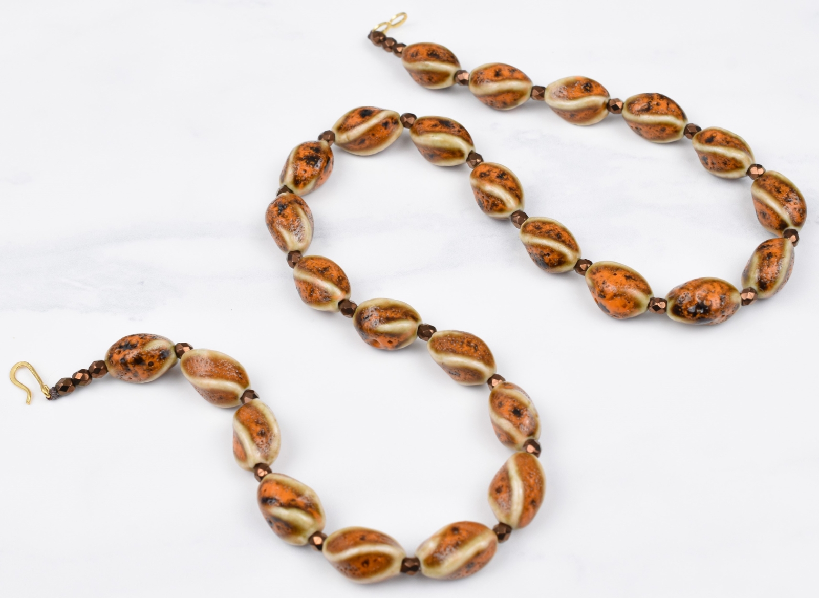 Gold Plated 21″ Cream Brown Orange Twist Ceramic Necklace w/ Bronze Spacers