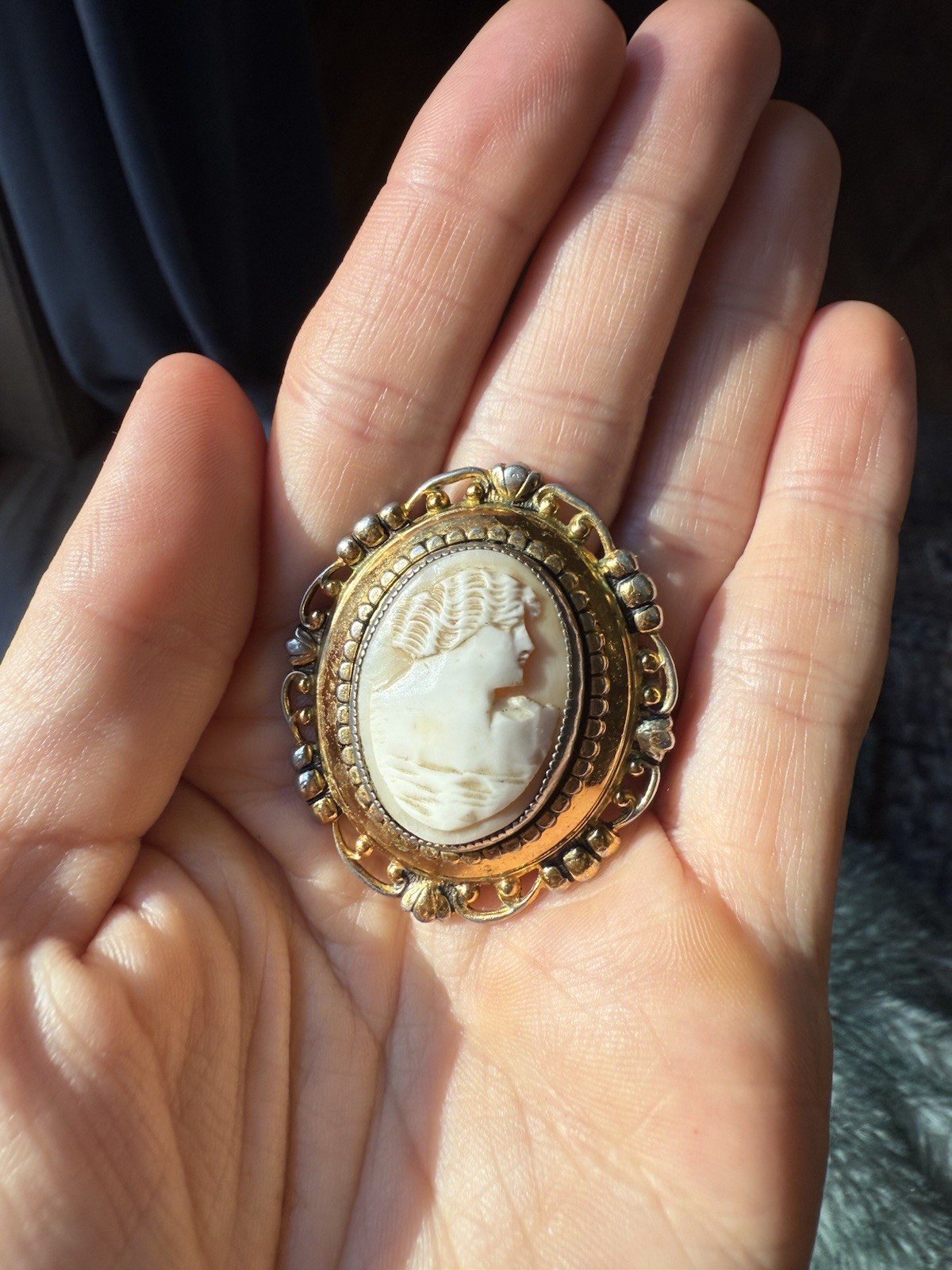 Right facing antique hand-carved shell cameo brooch with gold-filled setting
