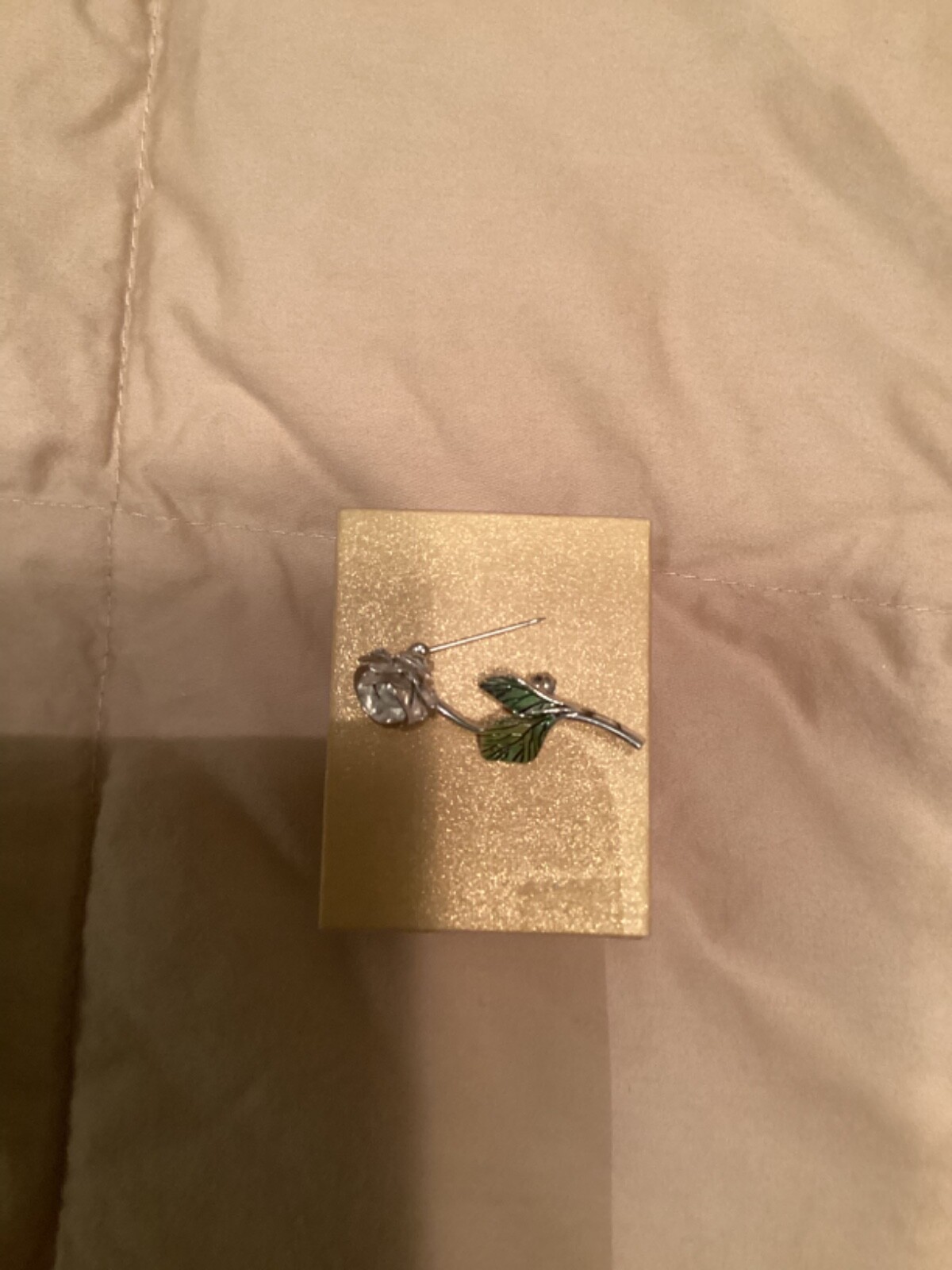 Avon vintage pin clear looking center with green leaves small almost 2” detailed
