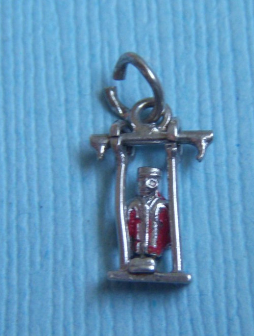 Vintage movable enamel person on swing sterling charm