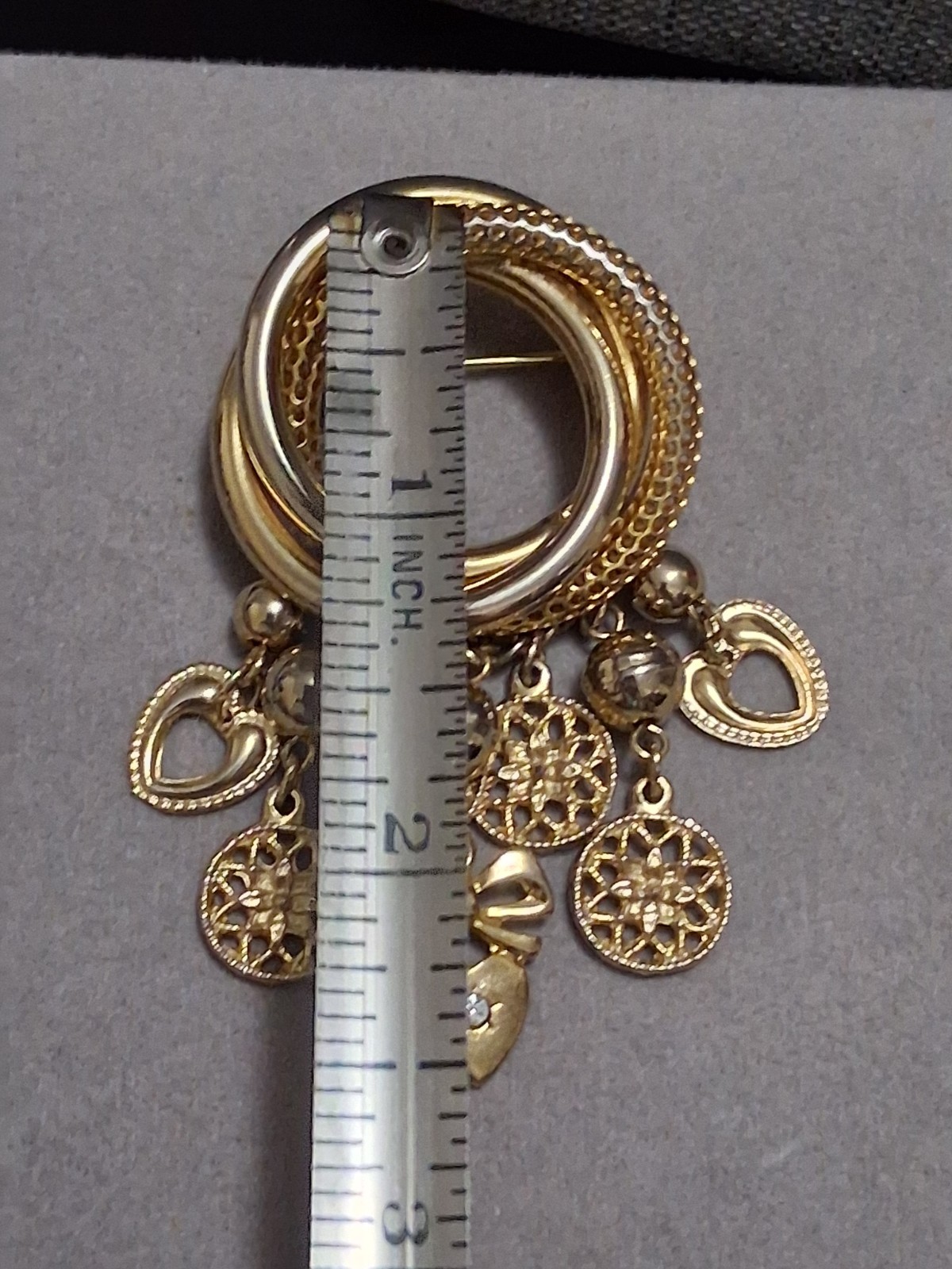 Interlocking circle charm brooch, gold-toned dangle drop charms