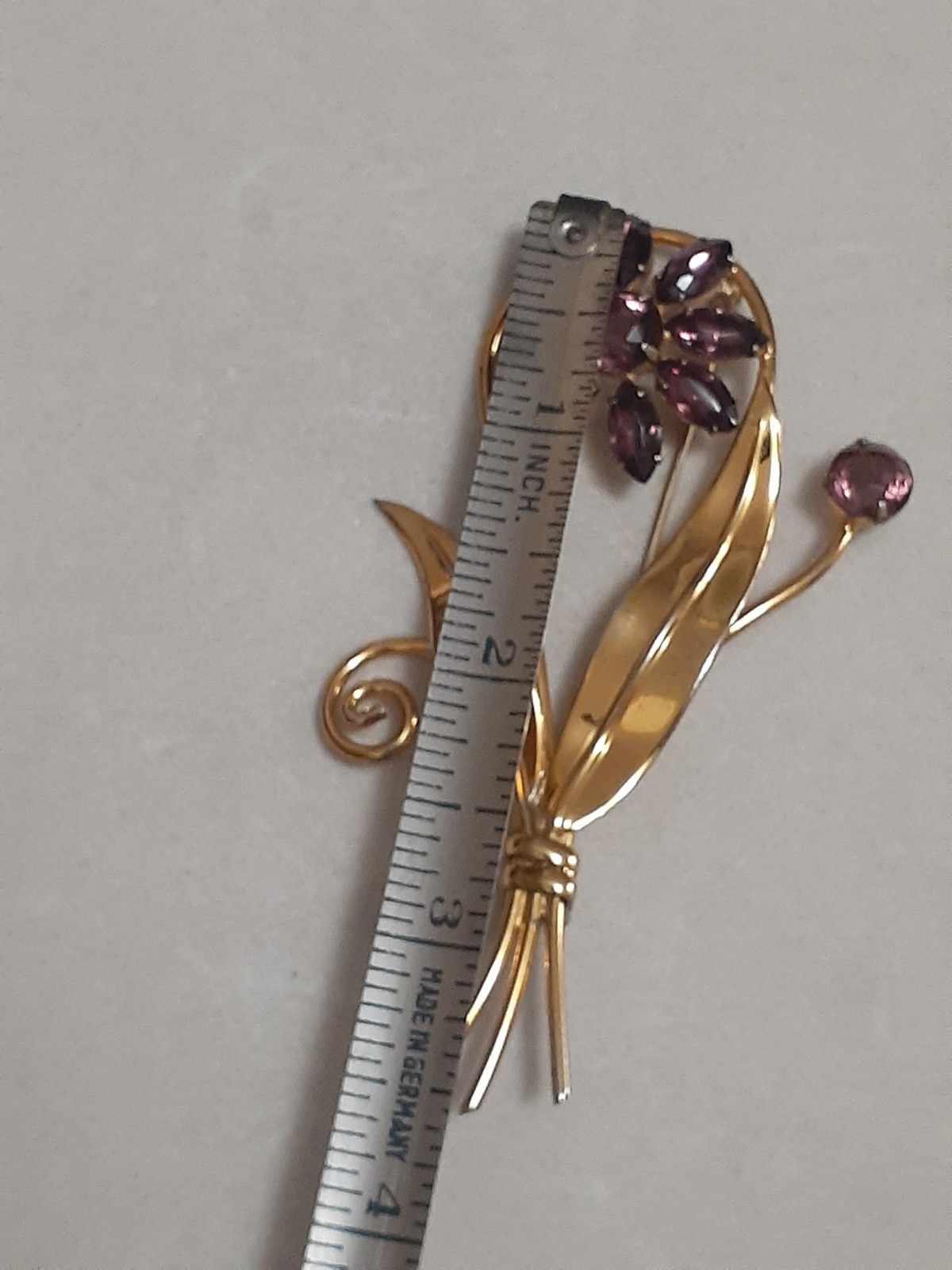 Sterling silver gold plated prong set purple glass flower & stem leaf brooch